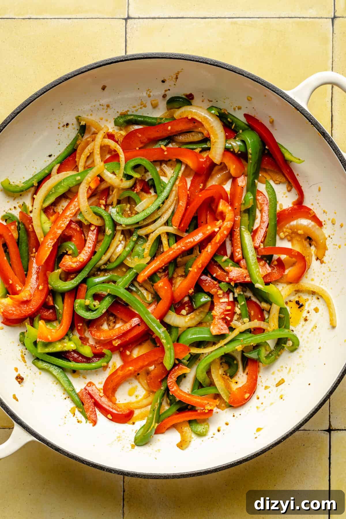 Sauteed peppers in a skillet.