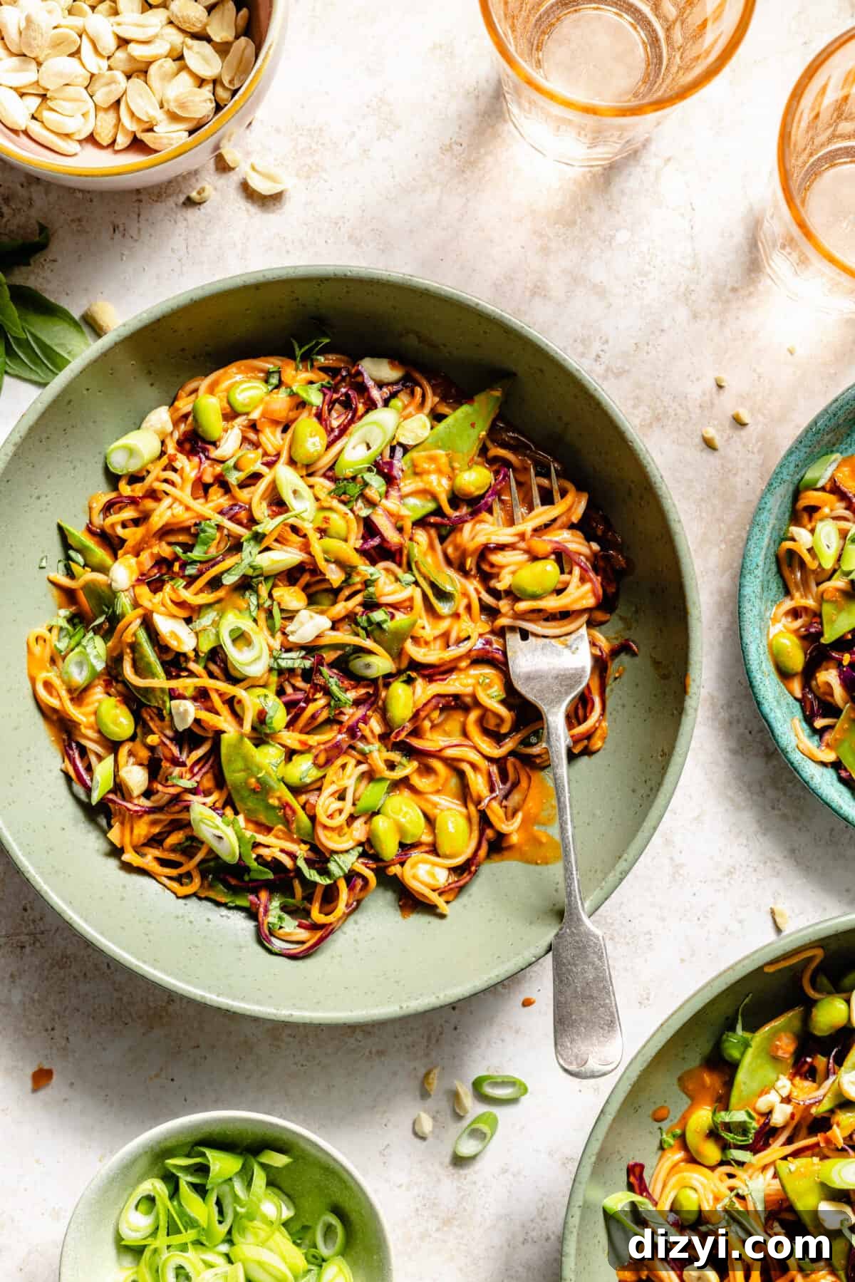 Gochujang Peanut Noodles with Crisp Vegetables 6 Gochujang and Peanut Veggie Noodles in green bowls.