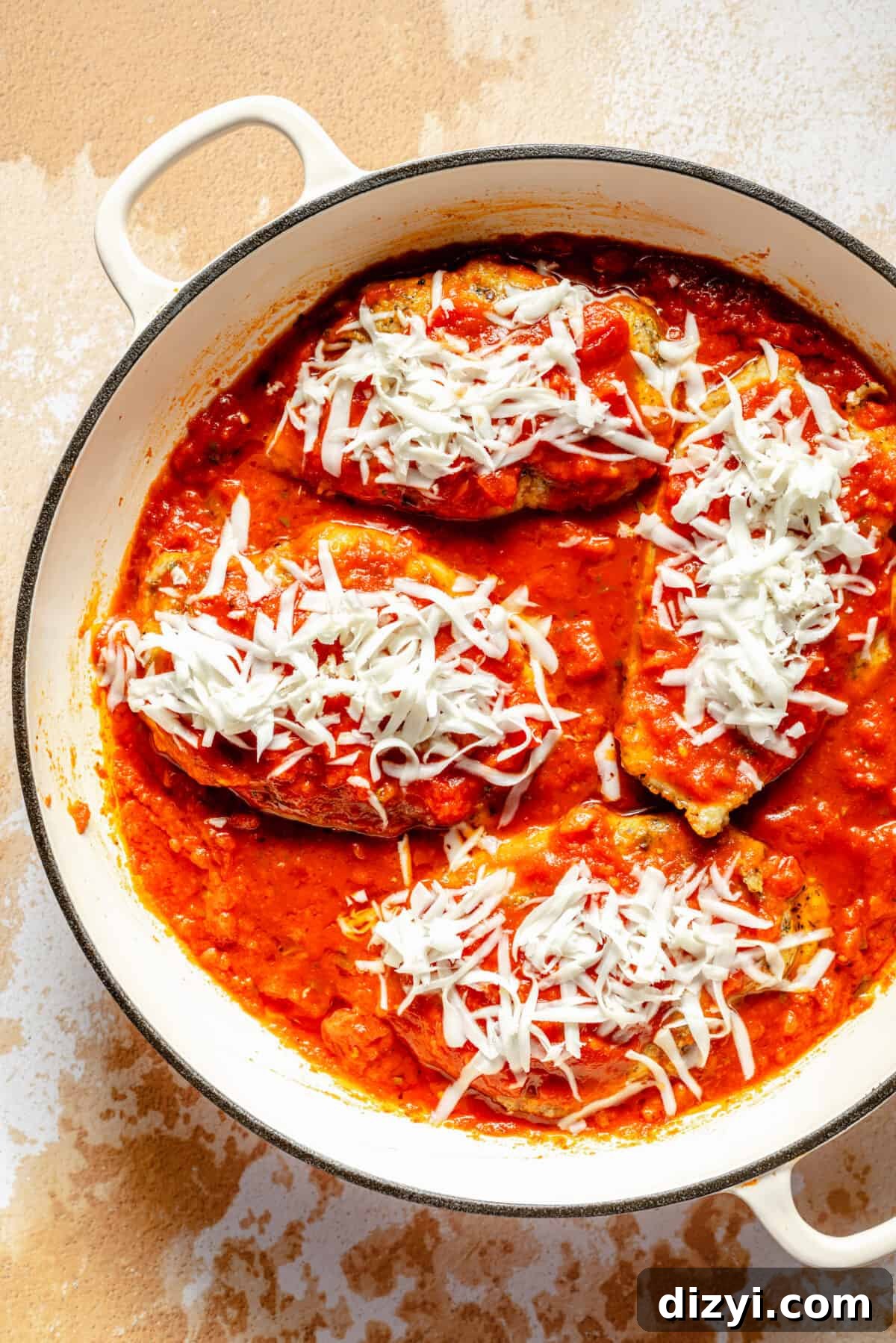 DIY Tie-Dye Chicken Craft: Colorful Step-by-Step Project 5 Browned chicken breasts in skillet with sauce and cheese