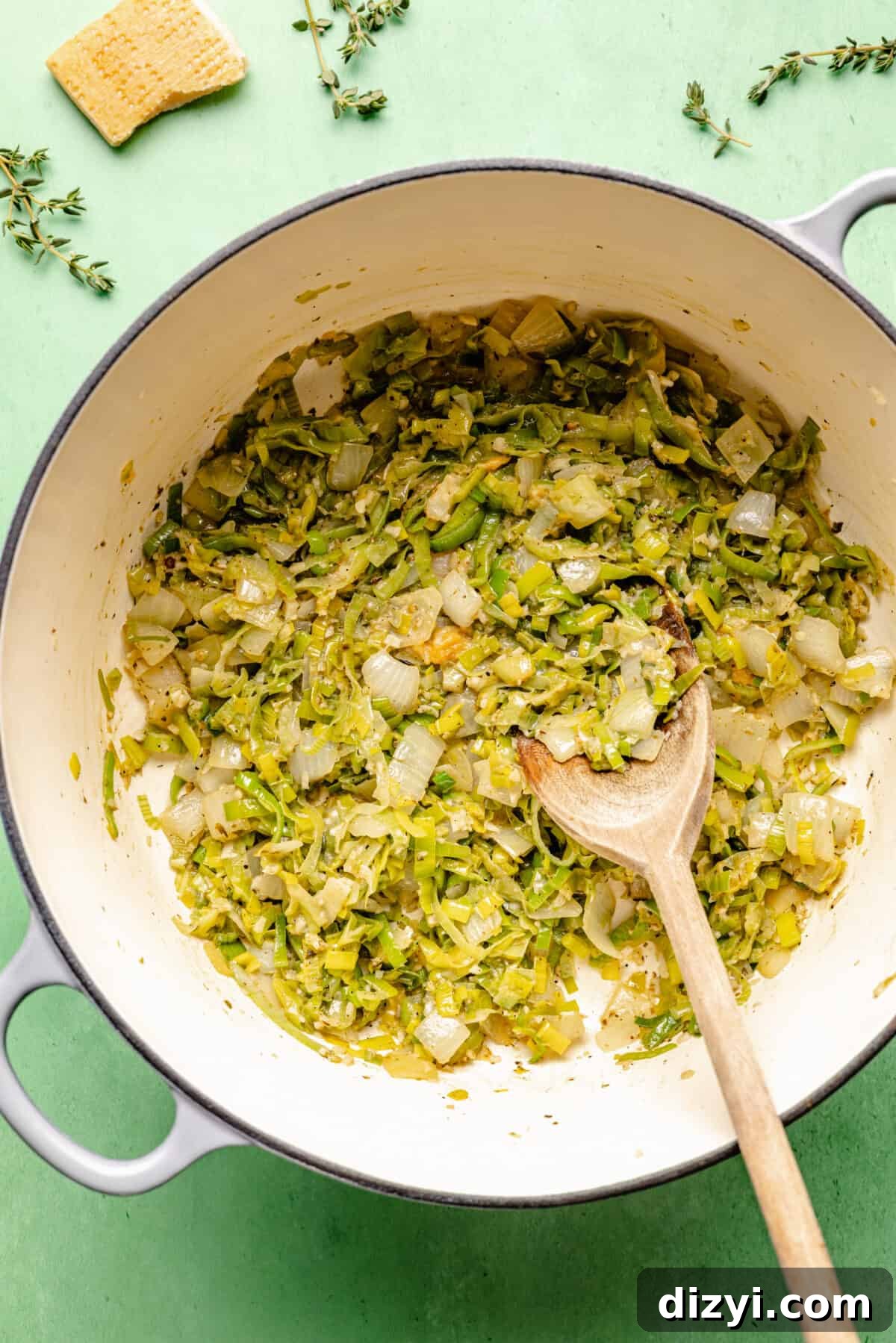 Spring Green Minestrone Soup Recipe with Fresh Spring Vegetables 4 Veggies sauteed in white dutch oven.
