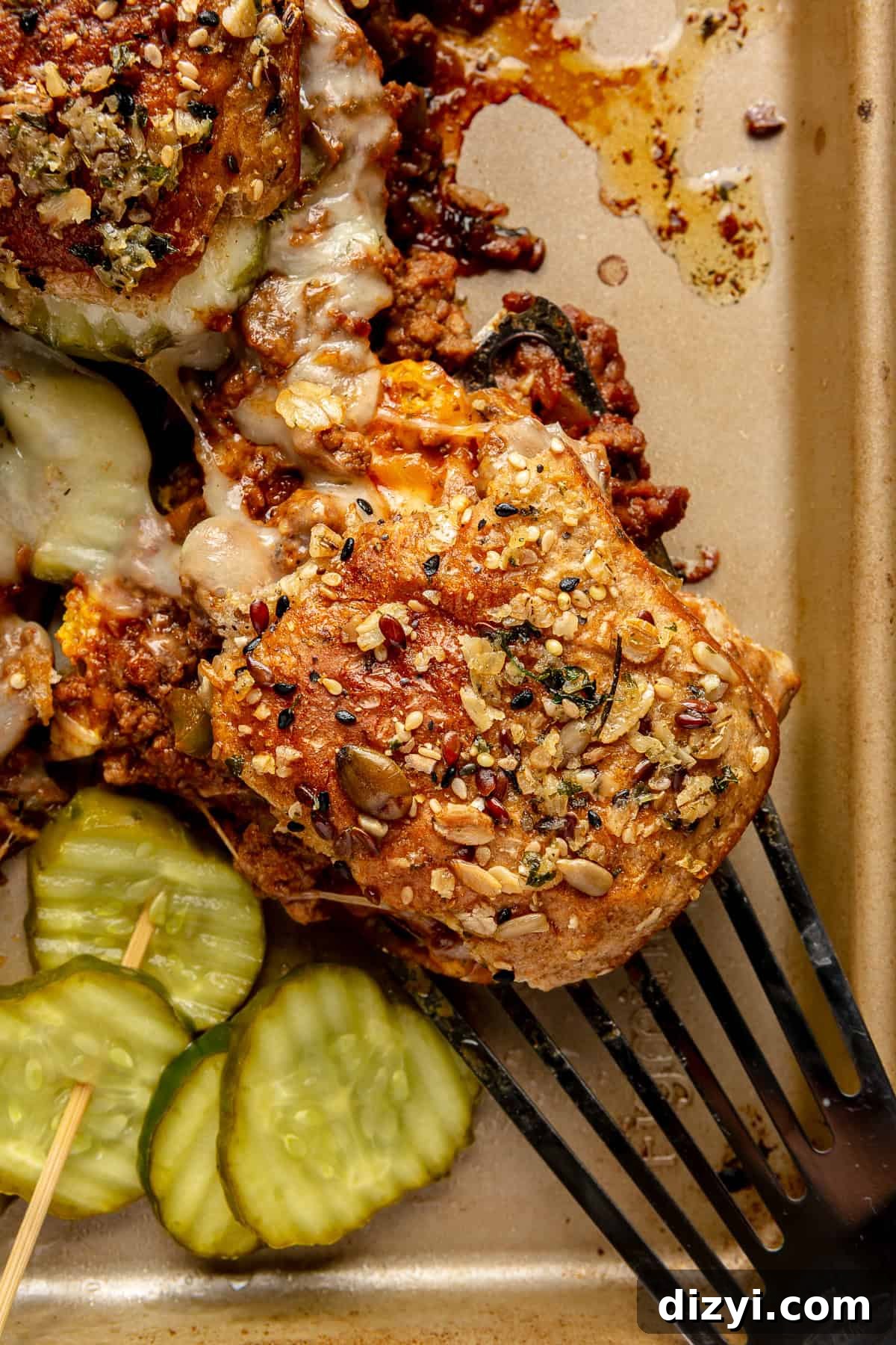 Close up of Sloppy Joey lifting off sheet pan with a spatula.