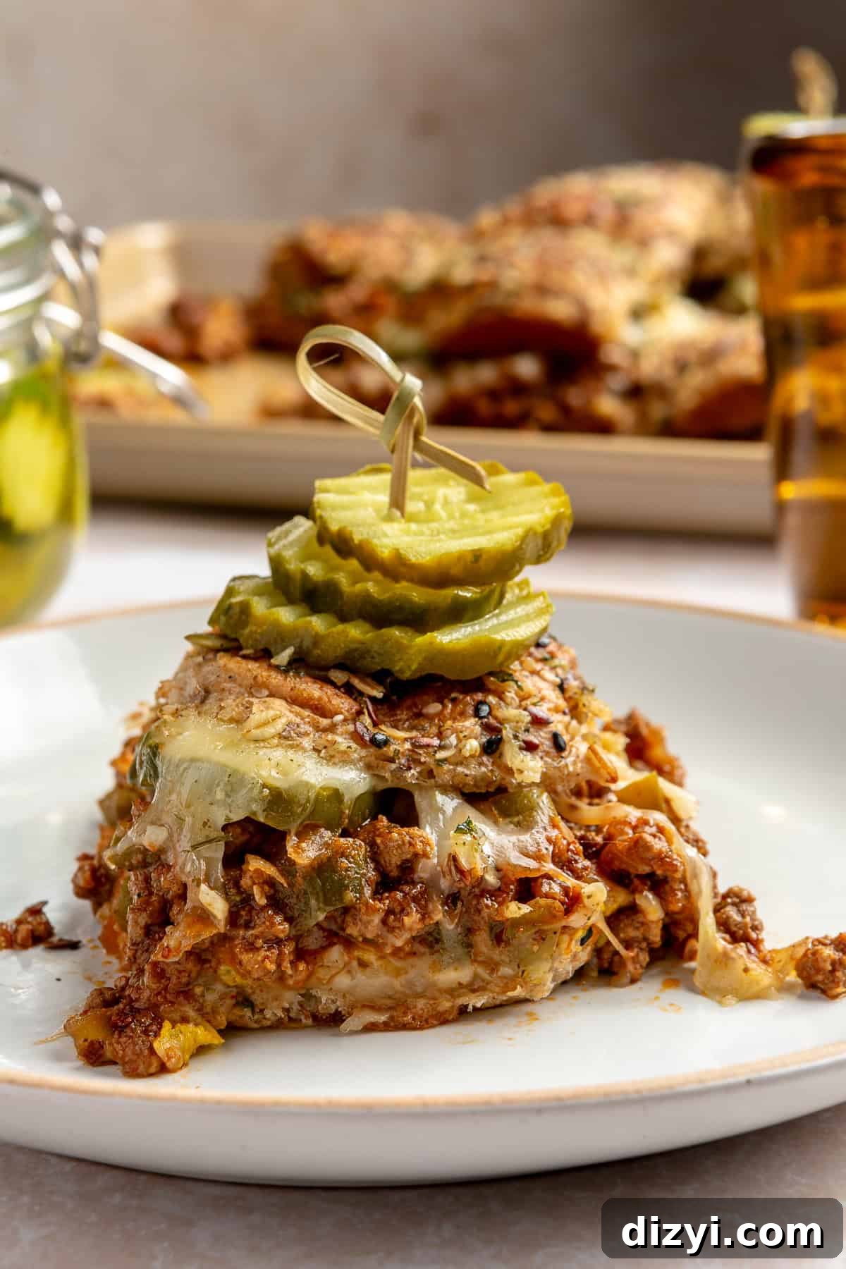 Sloppy Joey plated with toothpick of pickles.