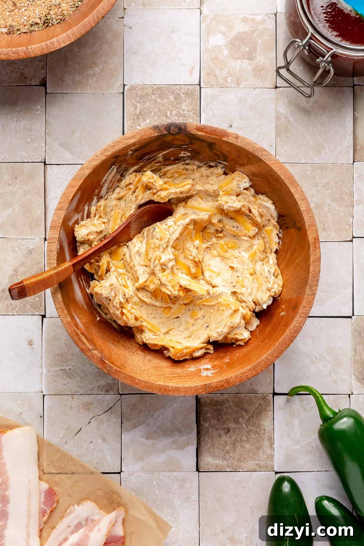 Cream cheese filling in small wooden bowl.