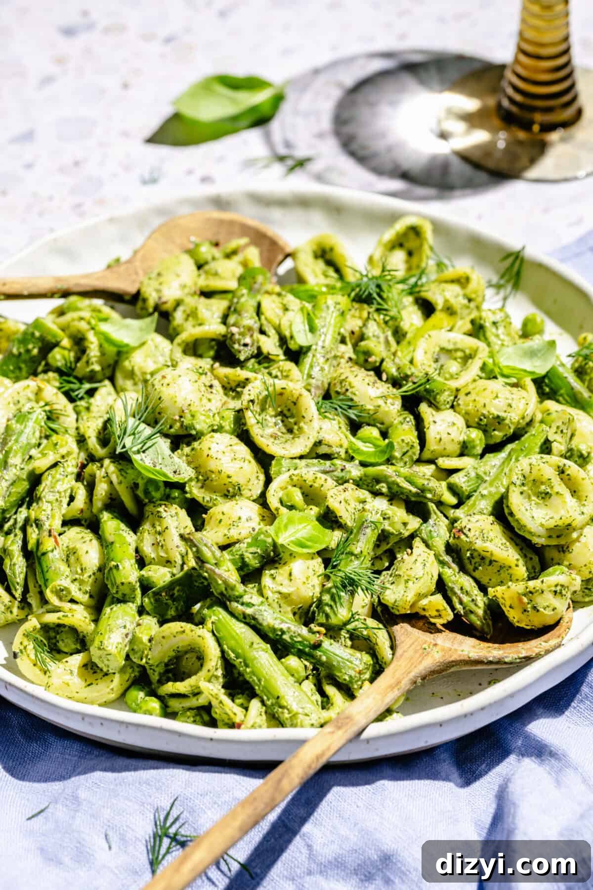 Creamy Green Goddess Pasta Salad with Avocado and Fresh Herbs 3 Green Goddess Pasta Salad in white serving bowl with two serving spoons.