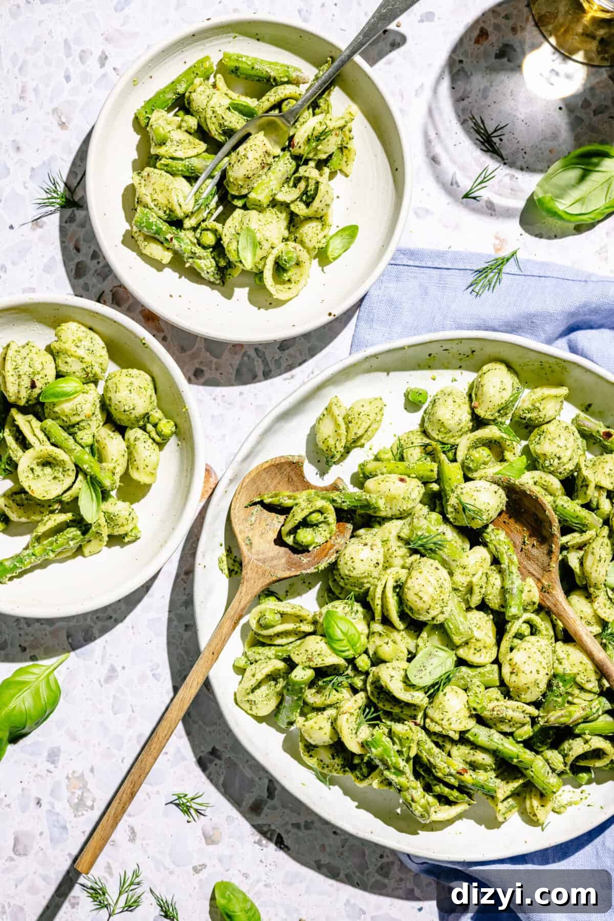 Creamy Green Goddess Pasta Salad with Avocado and Fresh Herbs 6 Green Goddess Pasta Salad in serving bowl and on two plates.