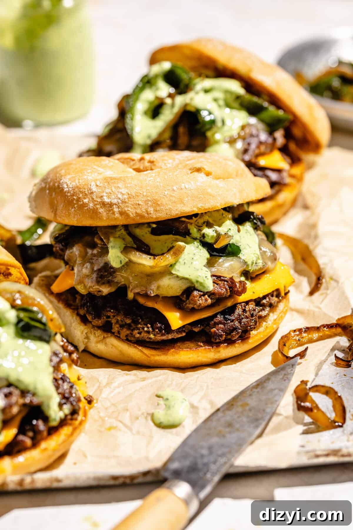 Monterey Melt Smash Burgers on parchment paper.