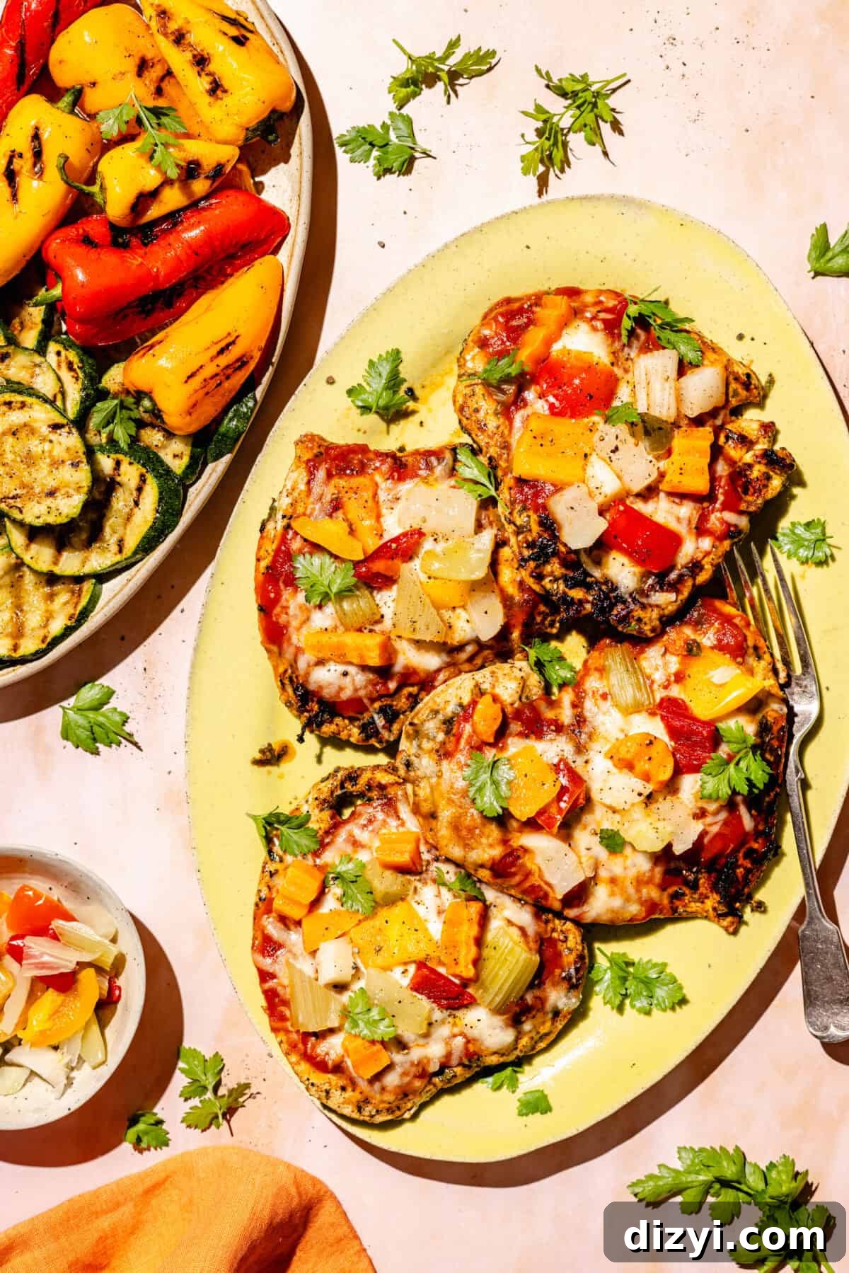 Giardiniera Chicken Melts with side of grilled veggies on other platter.
