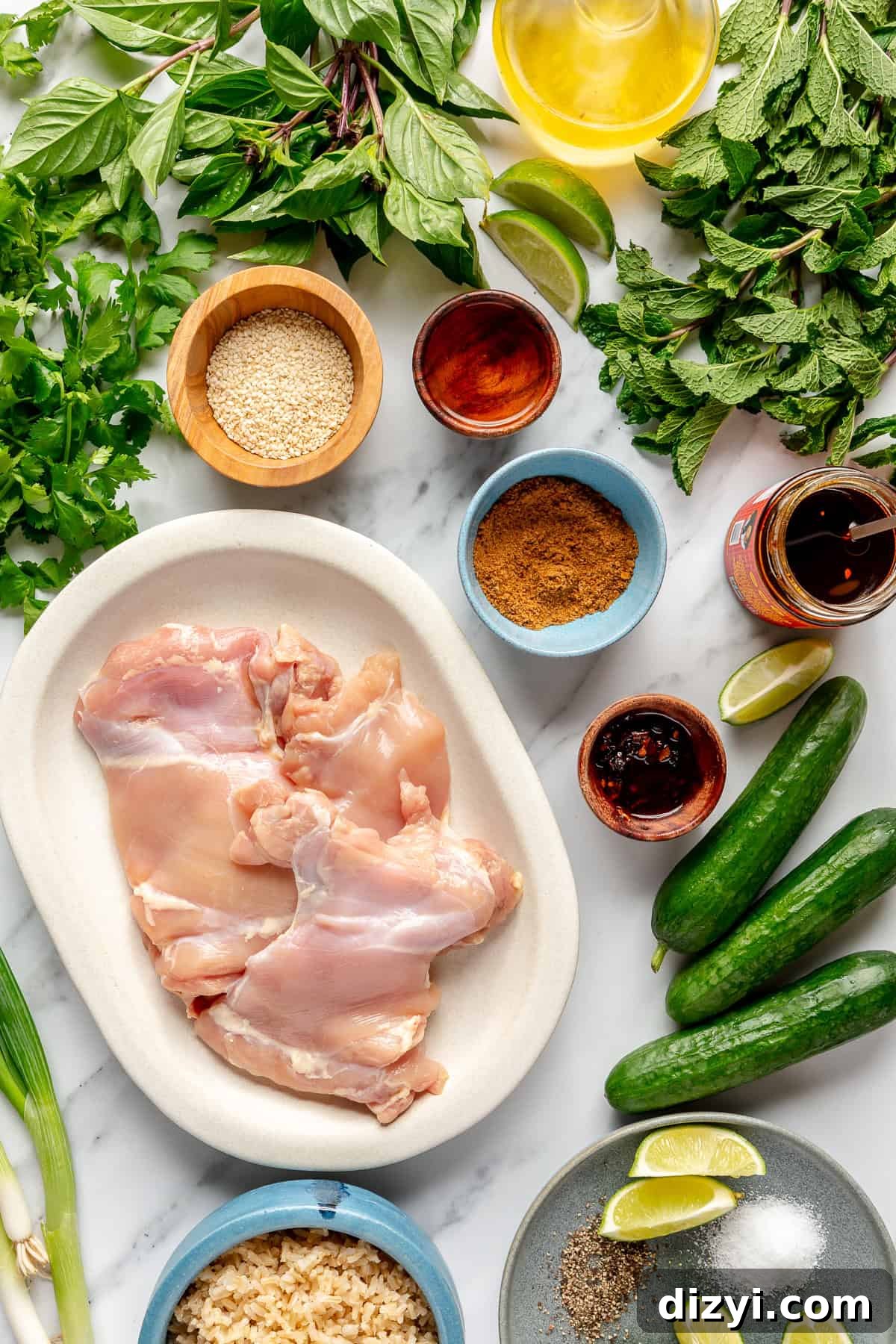 Ingredients for Chili Crisp Chicken Bowls scattered on counter.
