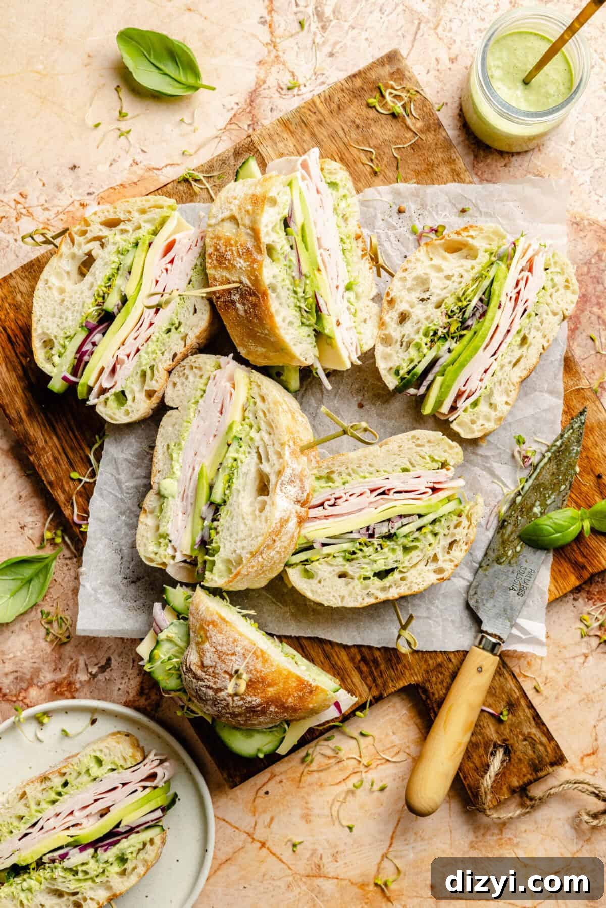 Green Goddess Party Sandwiches sliced on wood platter.