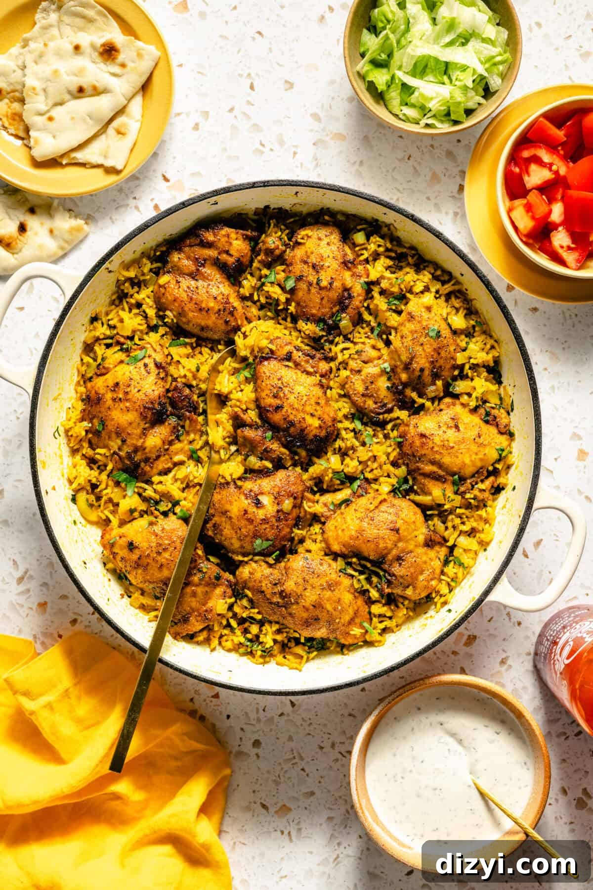 Halal-Inspired Chicken and Rice Skillet with toppings scattered around.