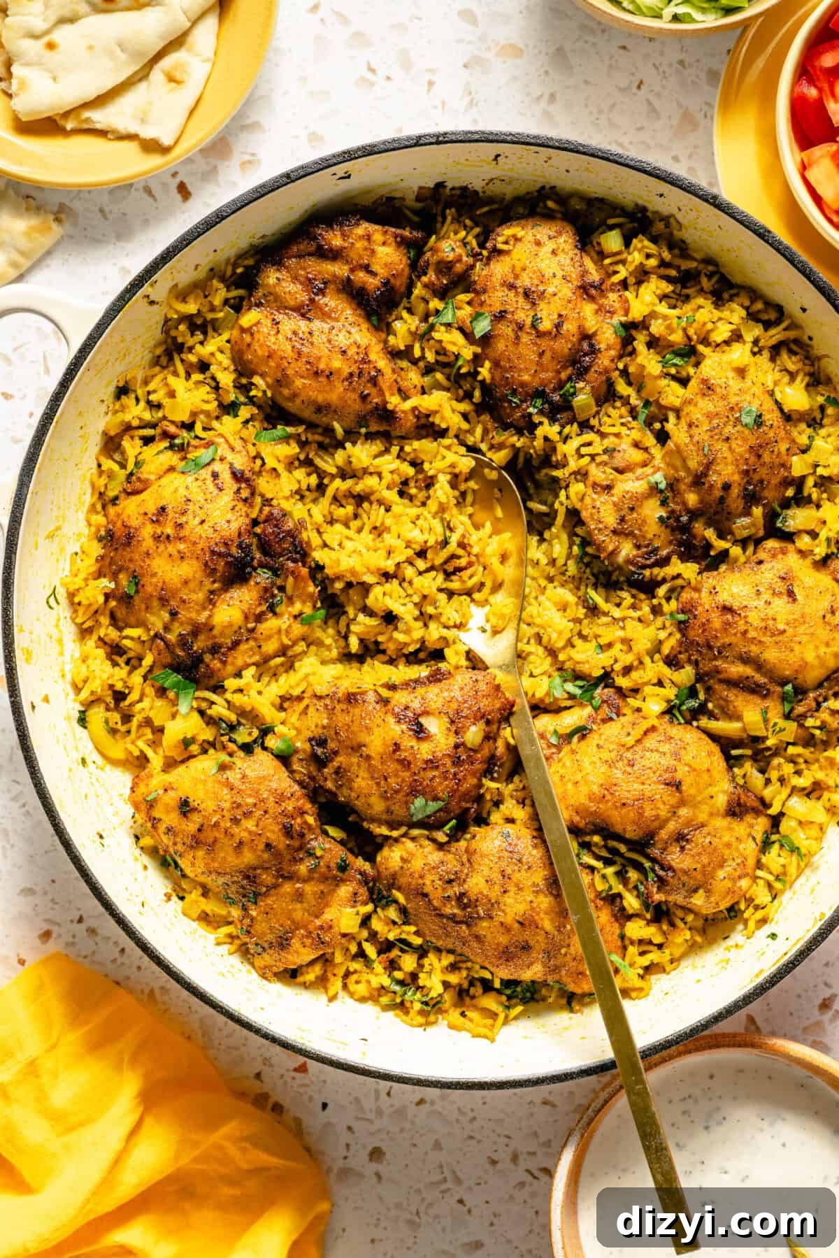 Halal-Inspired Chicken and Rice Skillet with scoop out of it.