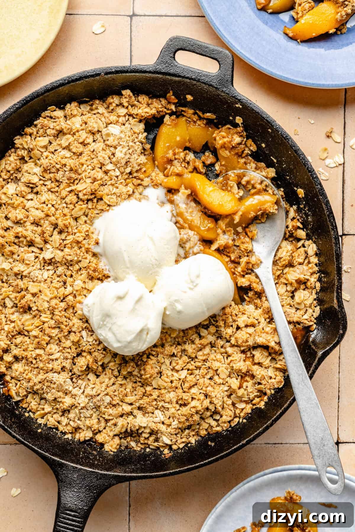 Simple Skillet Peach Crumble in black cast iron skillet.