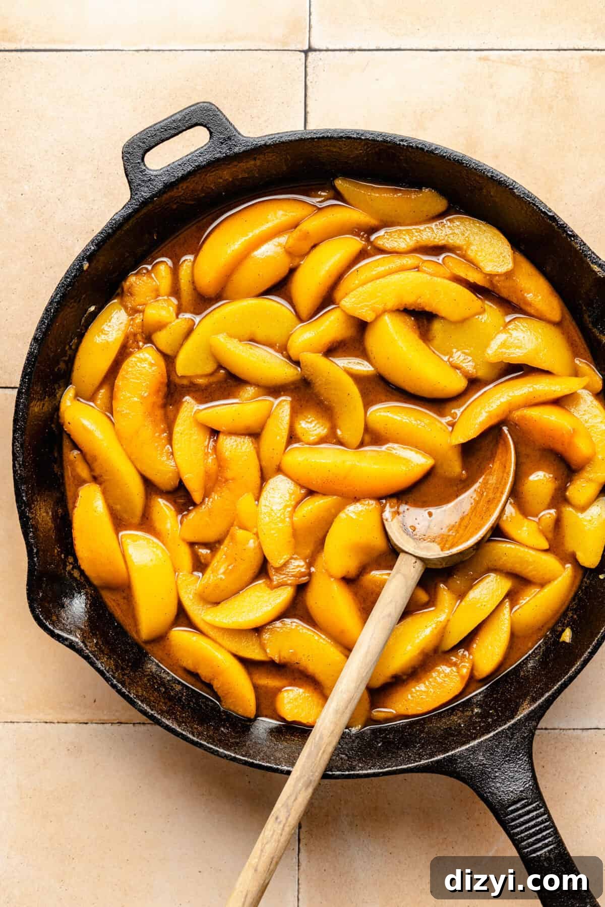 Peaches sauteed in cast iron skillet.