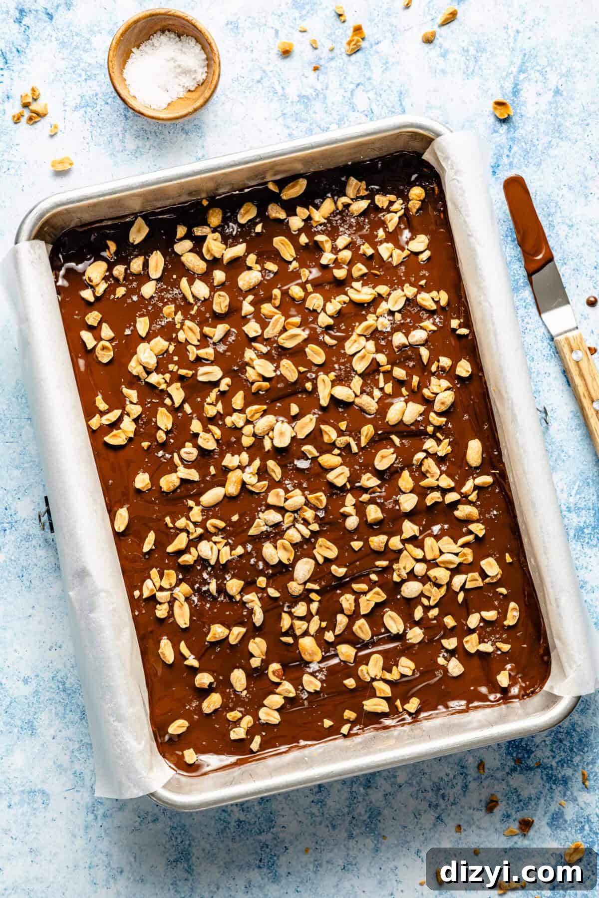 The finished Gluten-Free Take 5 Bars in the pan with the chocolate and peanuts added.