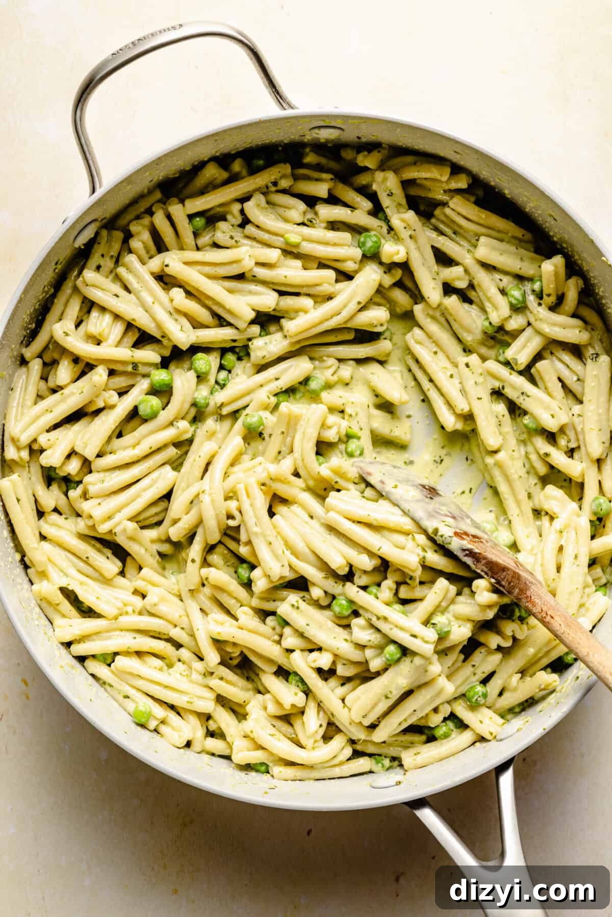 The Creamy Pesto Chicken Pasta in a skillet on a countertop, before the chicken is added.