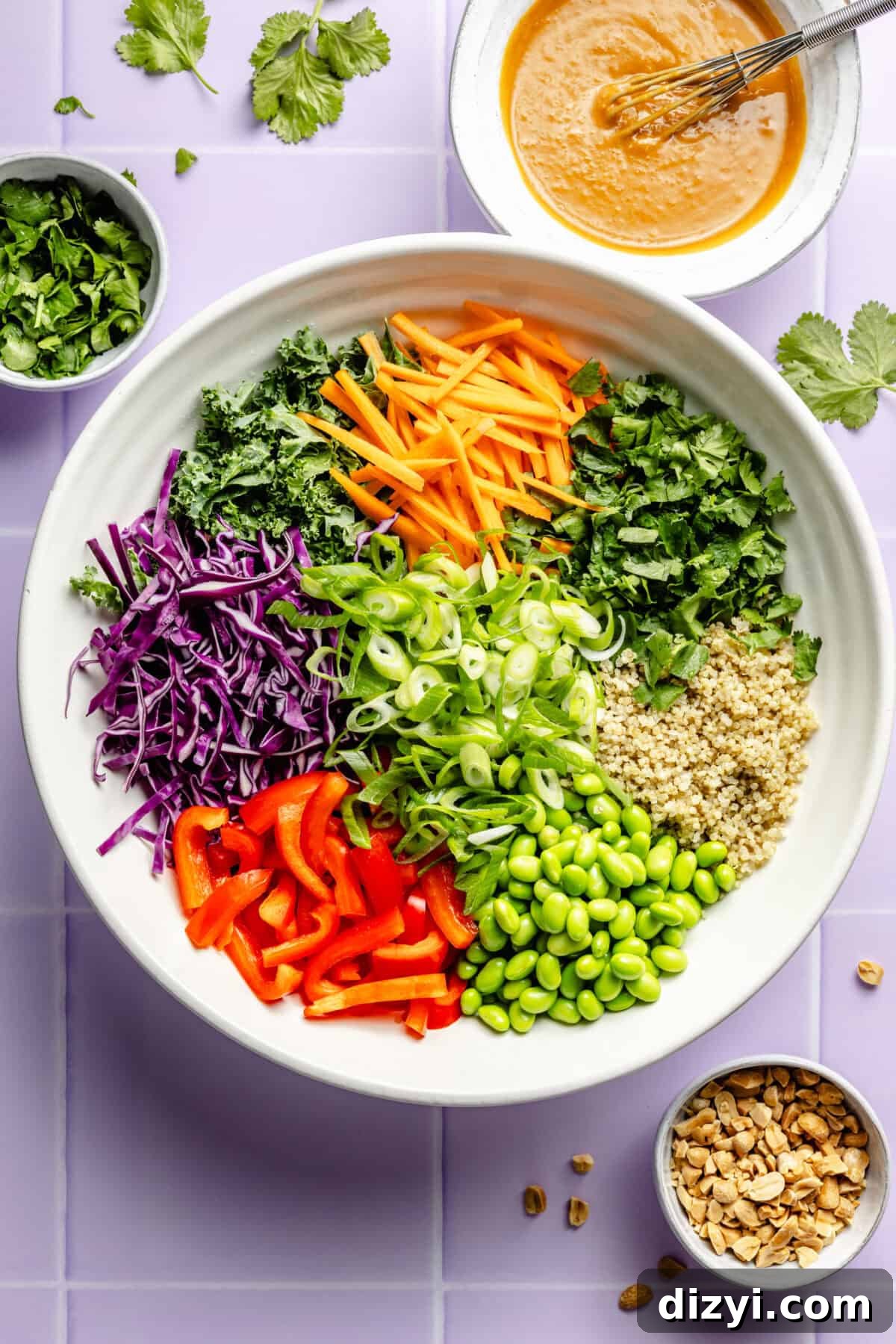 Crunchy Thai Quinoa Salad with Peanut Lime Dressing 4 The ingredients necessary to make Crunchy Thai Quinoa Salad, separated in a white bowl, before mixing.