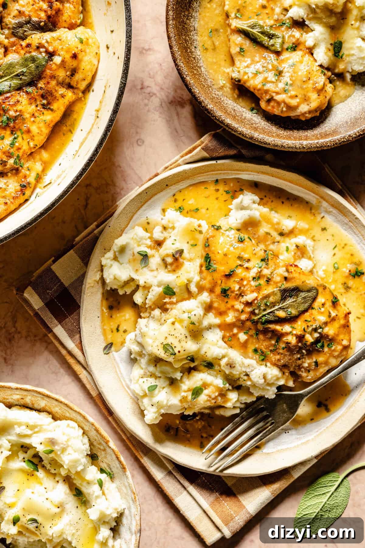 A finished plate of Chicken with Herby White Wine Gravy, with a few dishes visible in the corners.