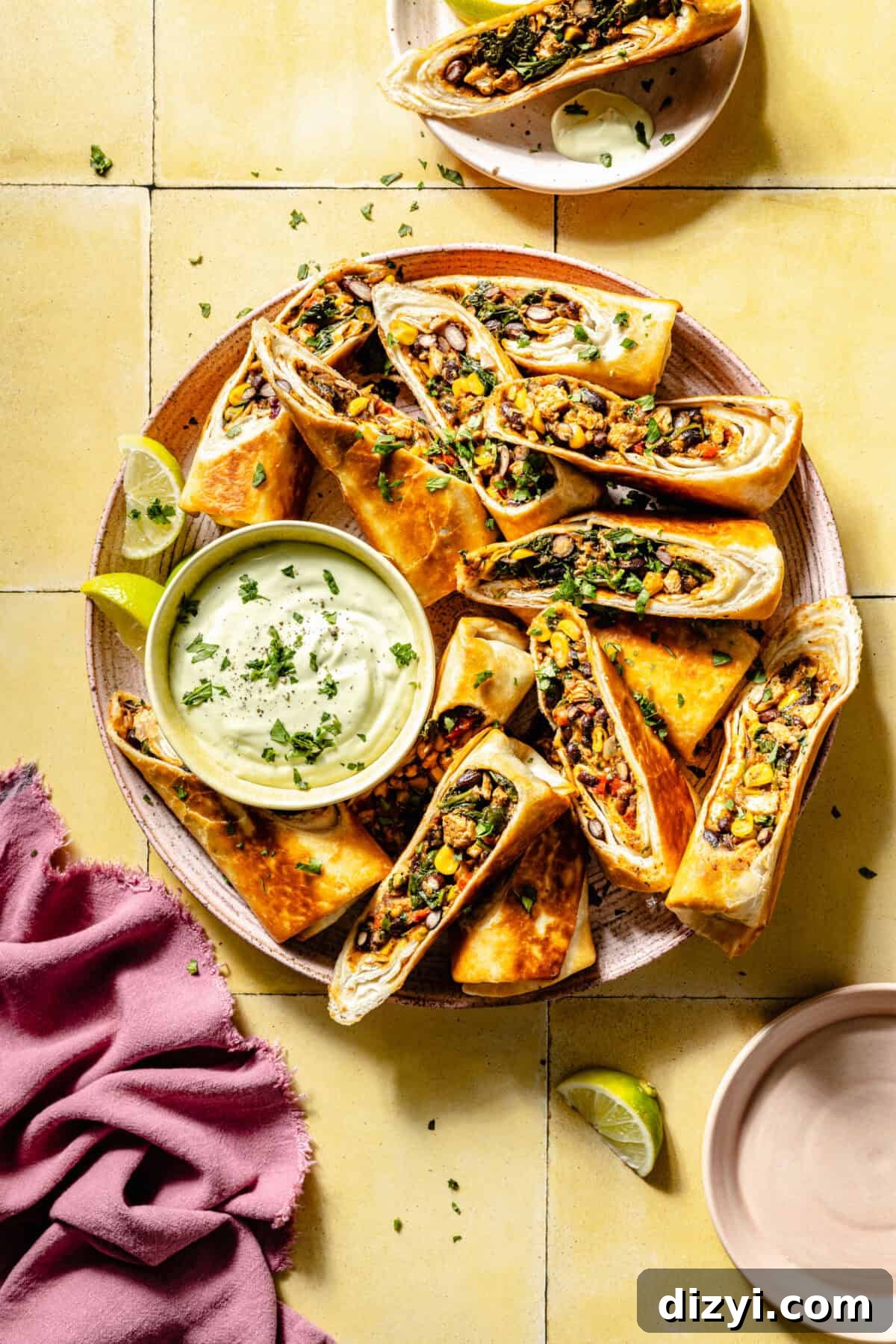 Crispy Southwestern Egg Rolls with Avocado Ranch Dip 2 Southwestern Egg Rolls on a plate with a bowl of ranch.