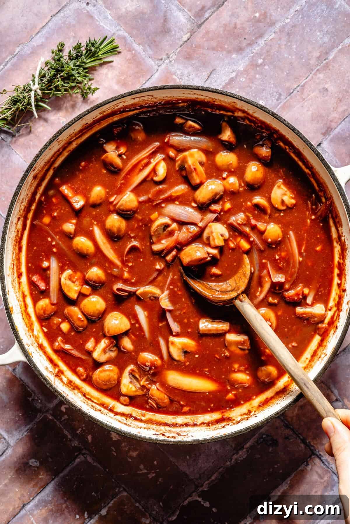 Coq Au Vin sauce in braiser.
