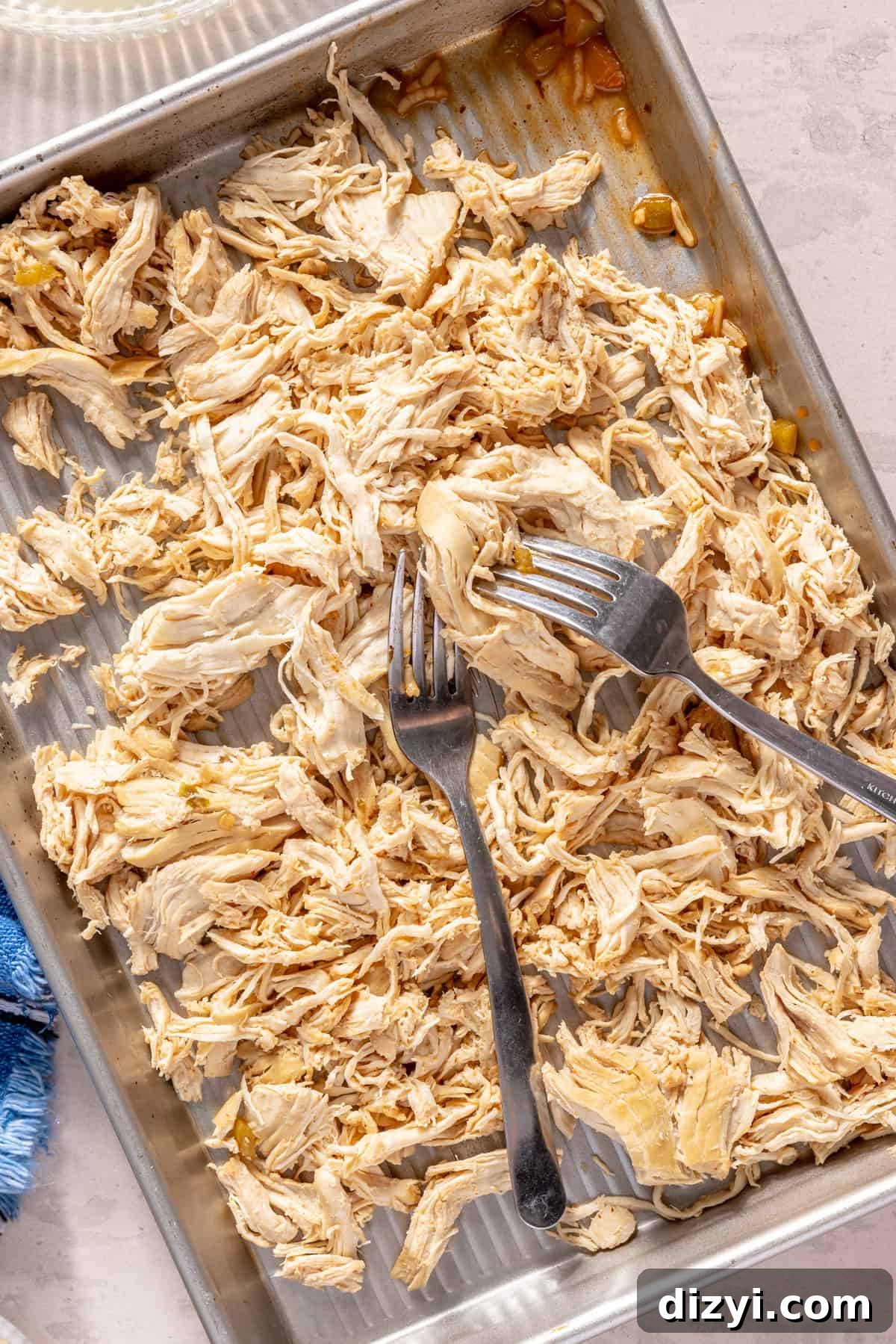 Shredded chicken on a sheet pan.