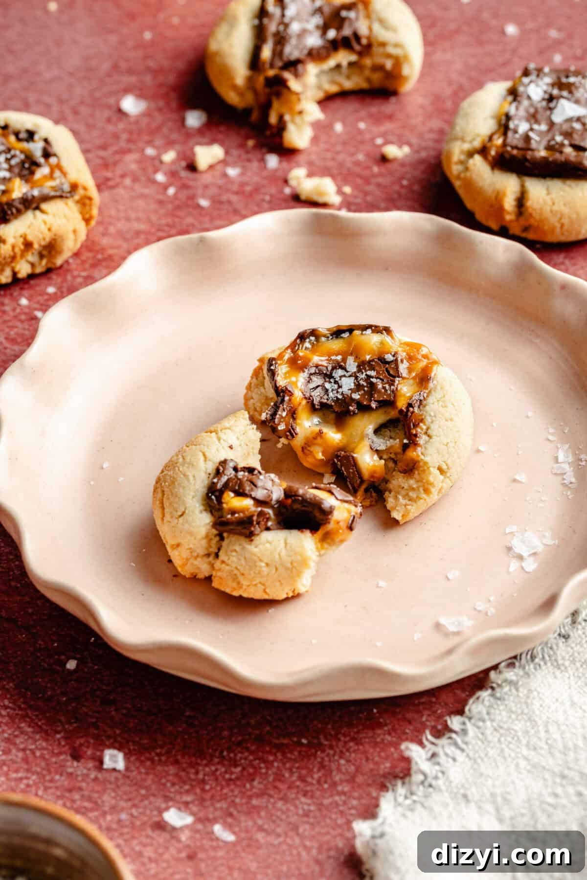 Chocolate Candy Bar Thumbprint Cookies 3 Easy Candy Bar Thumbprint Cookie on a pink plate.