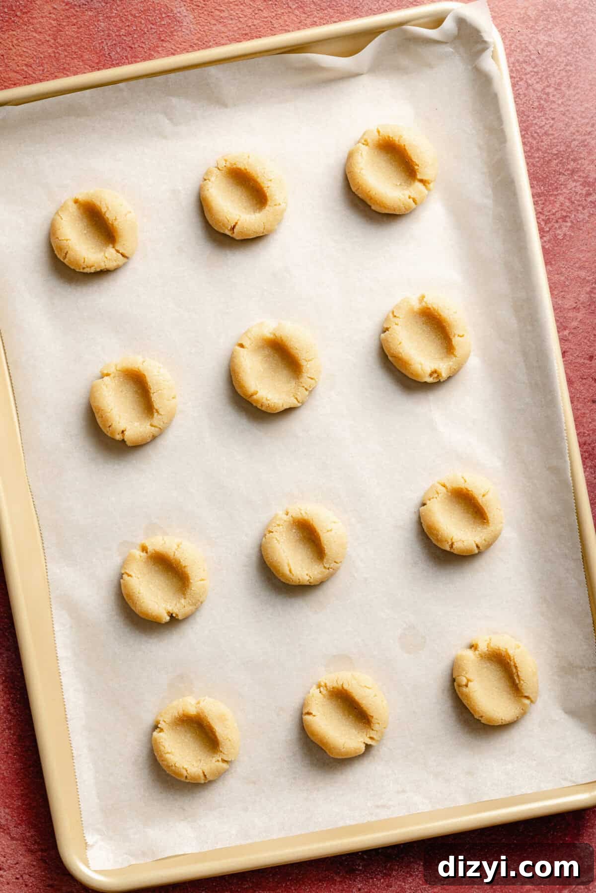 Chocolate Candy Bar Thumbprint Cookies 6 Easy Candy Bar Thumbprint Cookie dough on sheet pan.