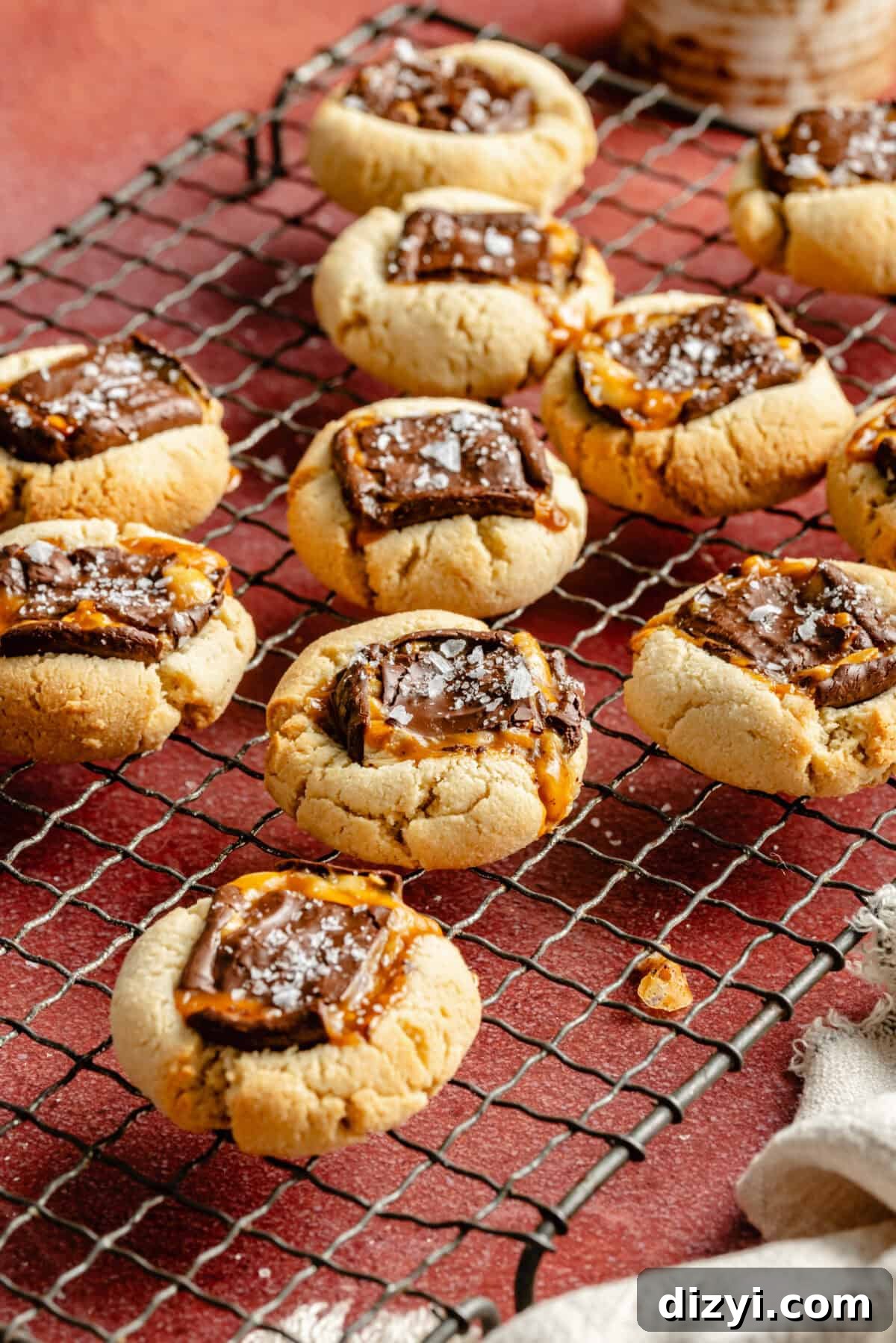 Chocolate Candy Bar Thumbprint Cookies 8 Easy Candy Bar Thumbprint Cookies on cooling rack.