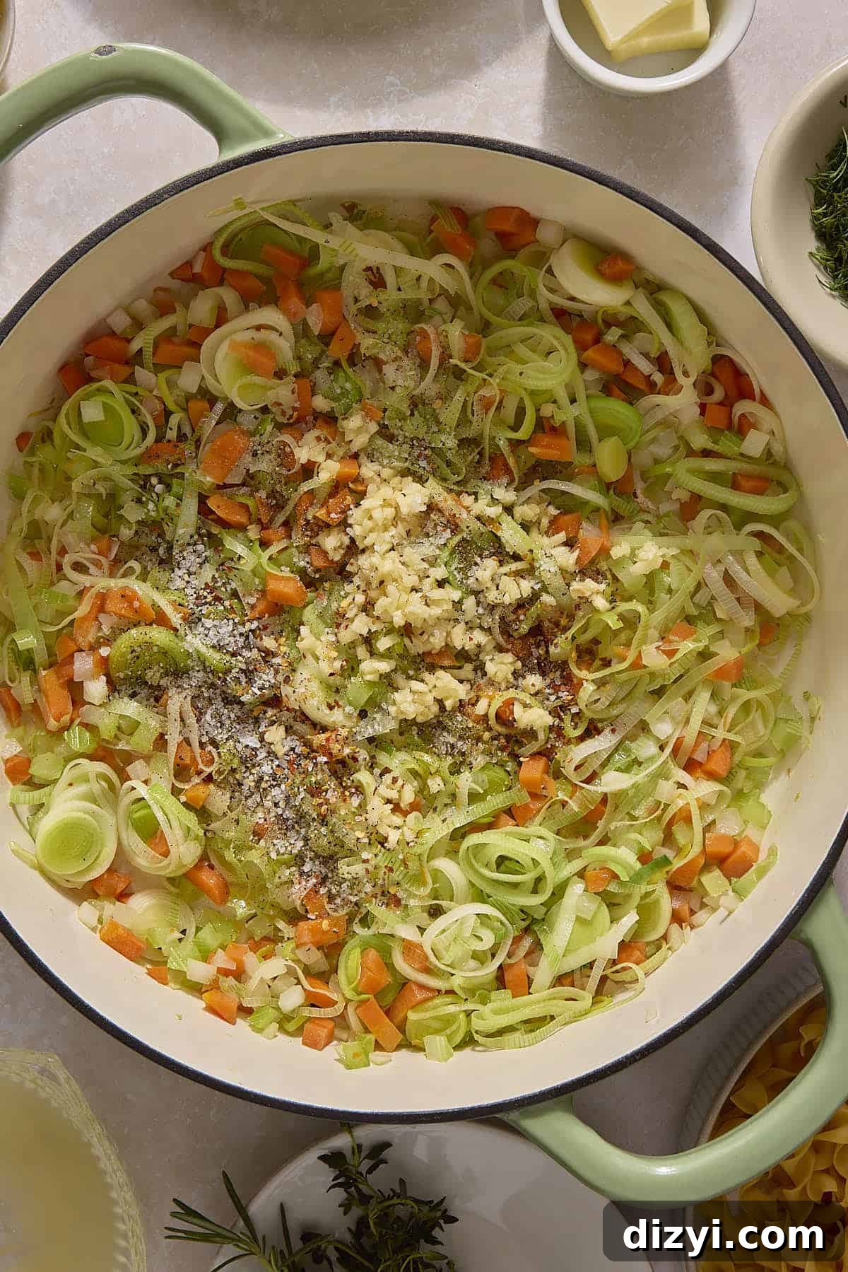 Classic Chicken and Leek Noodle Soup Recipe 4 Chicken and Leek Noodle Soup aromatics sauteing in dutch oven.