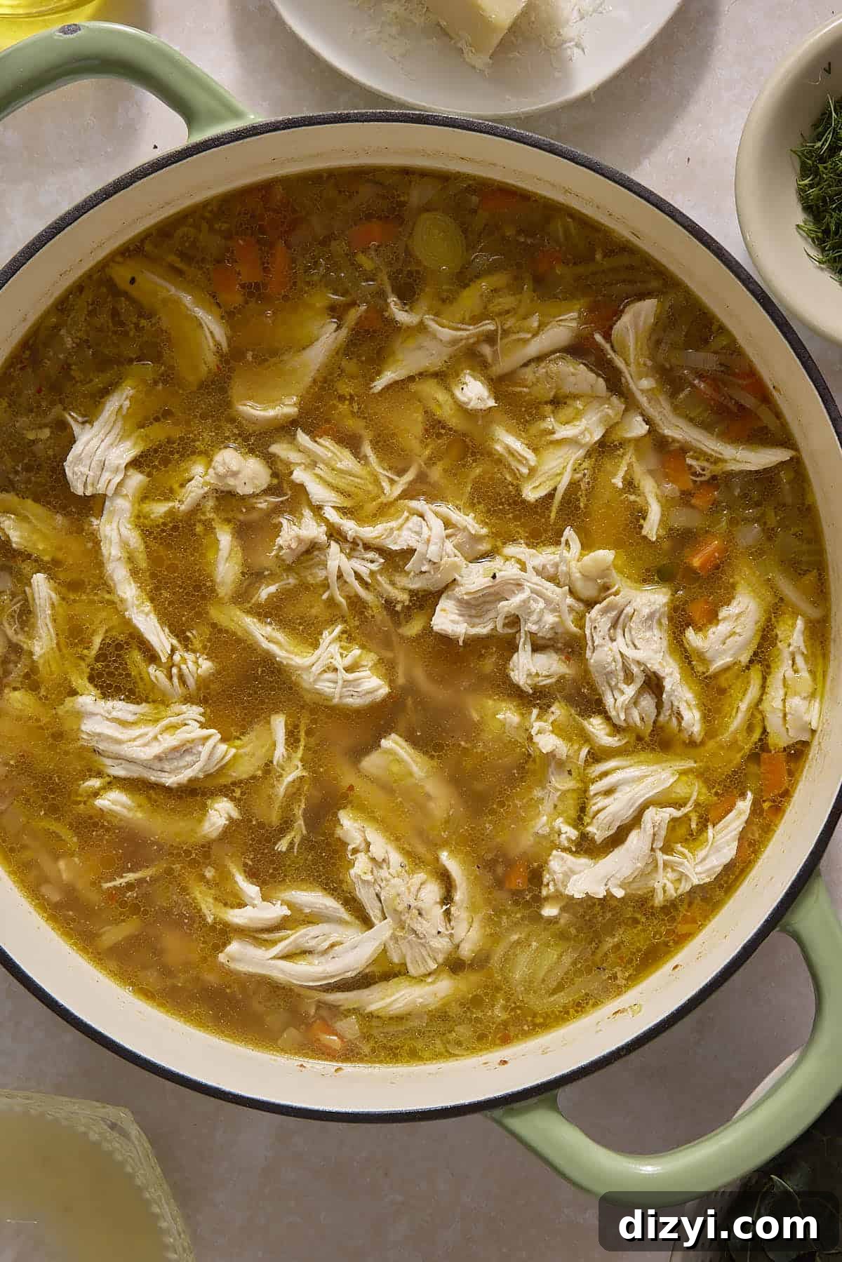 Classic Chicken and Leek Noodle Soup Recipe 6 Shredded chicken added into Chicken and Leek Noodle Soup pot.