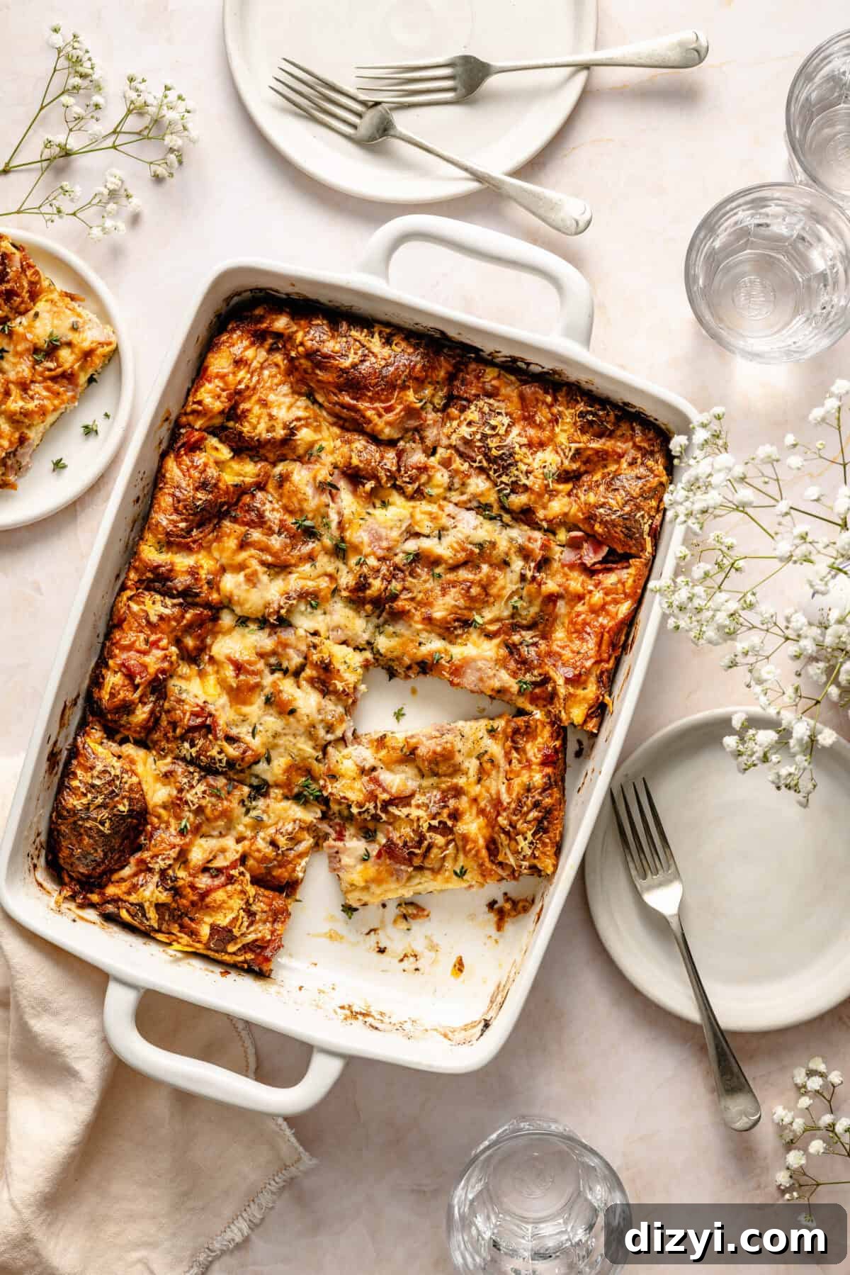 Croque Monsieur Breakfast Casserole with Ham and Gruyere 2 Croque Monsieur Breakfast Casserole sliced in baking dish.