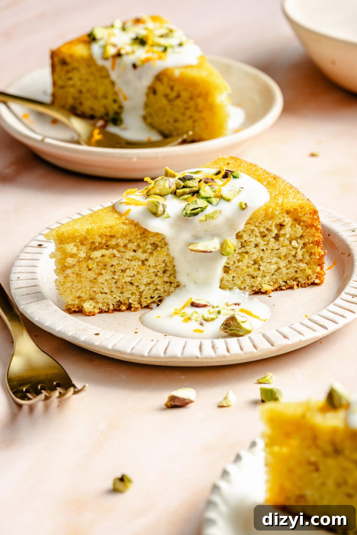 Citrus Greek Yogurt Cake slice that is garnished on plate.