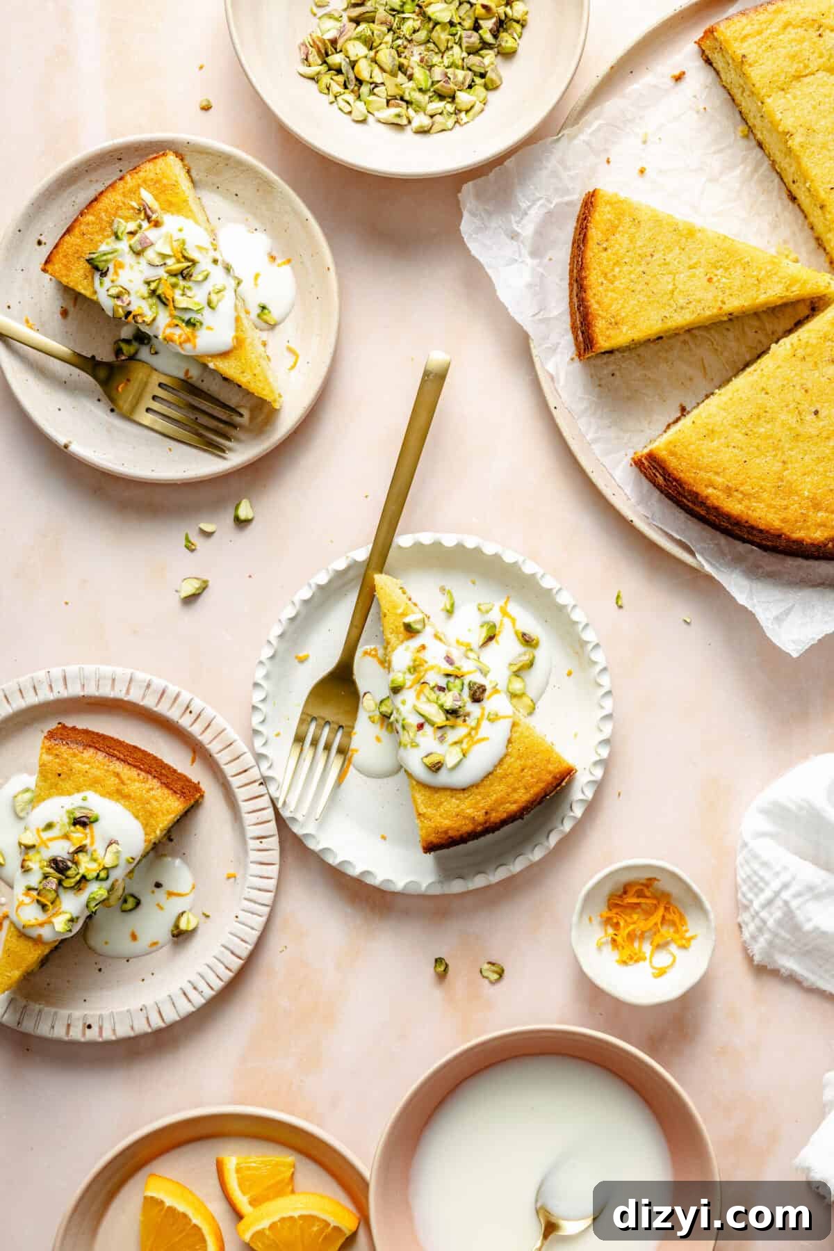Slices of Citrus Greek Yogurt Cake on plates. Some garnished, some plain.