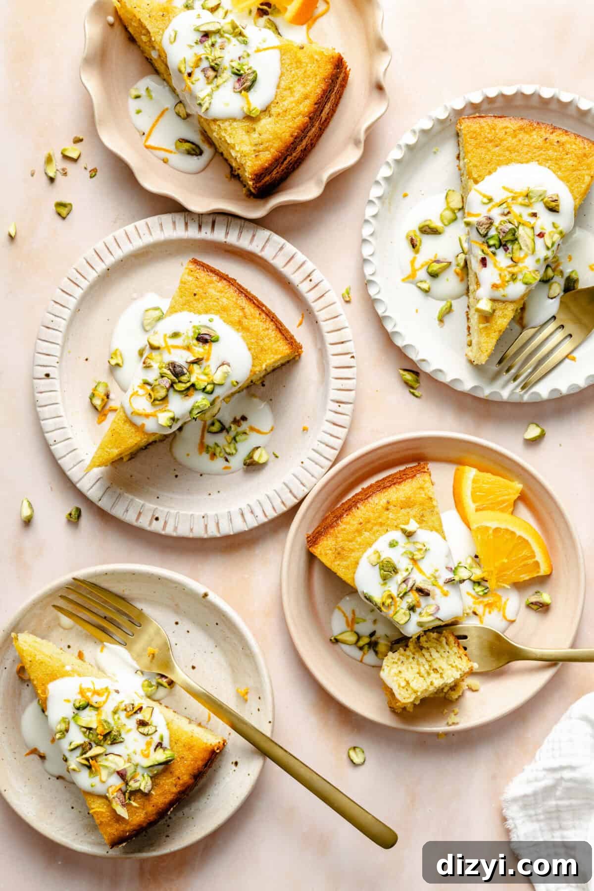 Slices of Citrus Greek Yogurt Cake garnished on plates.
