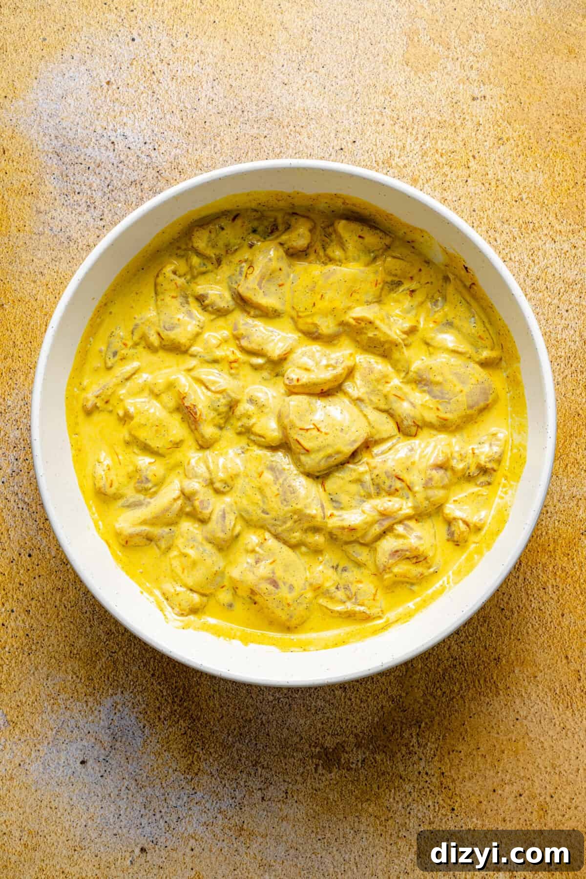 Persian-Inspired Chicken Kebabs marinating in bowl.