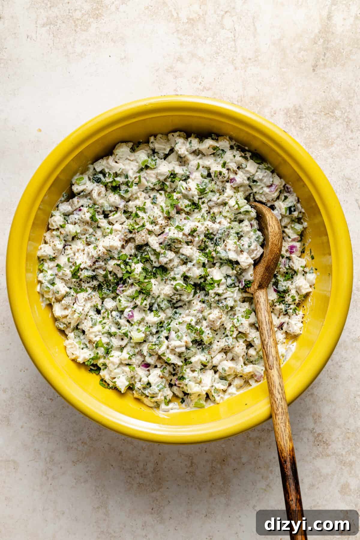 Clayton’s Favorite Chicken Salad mixed in yellow bowl.