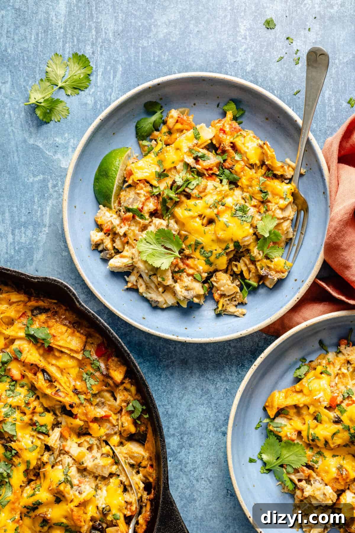 serving of cheesy chicken casserole with cilantro garnish