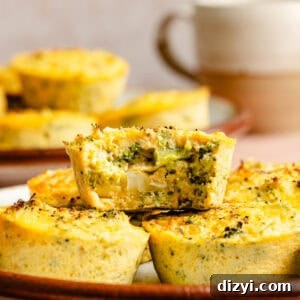 a stack of broccoli and cheddar egg bites with a white and brown coffee mug in the background