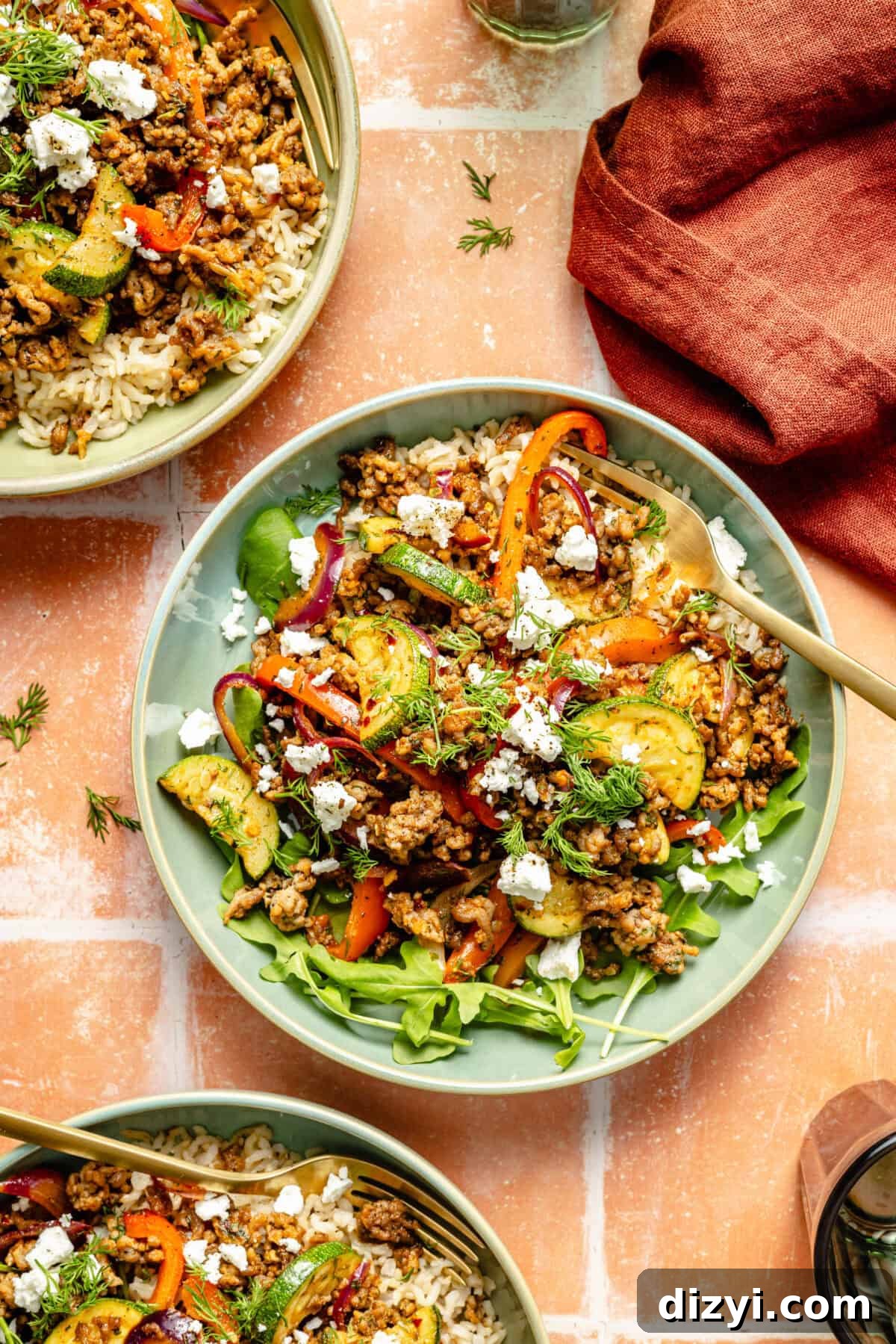One-Pan Mediterranean Beef and Vegetable Skillet Recipe 6 a large green bowl with a Mediterranean-inspired ground beef stir-fry and fresh herbs