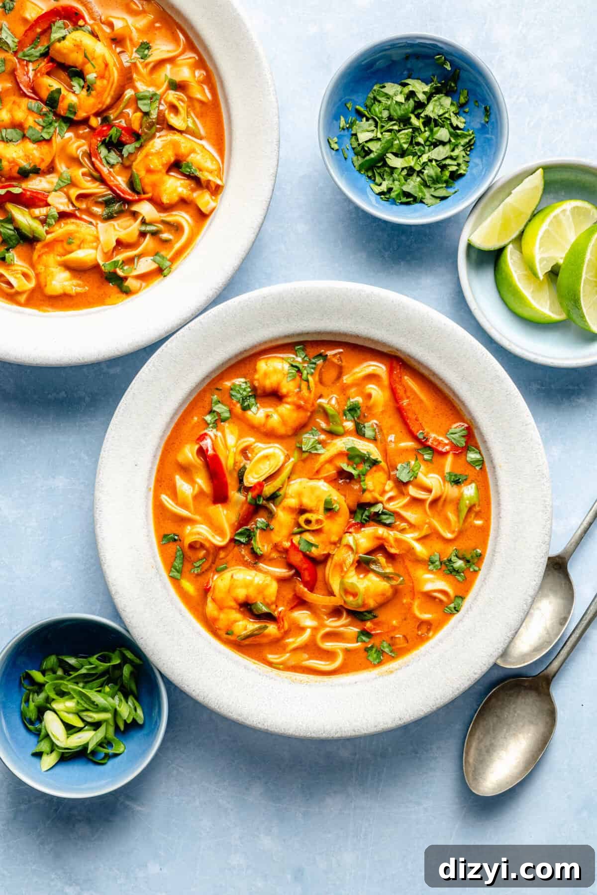 Spicy Gochujang Coconut Shrimp Noodle Soup 2 two bowls of gochujang and coconut shrimp with limes and green onions