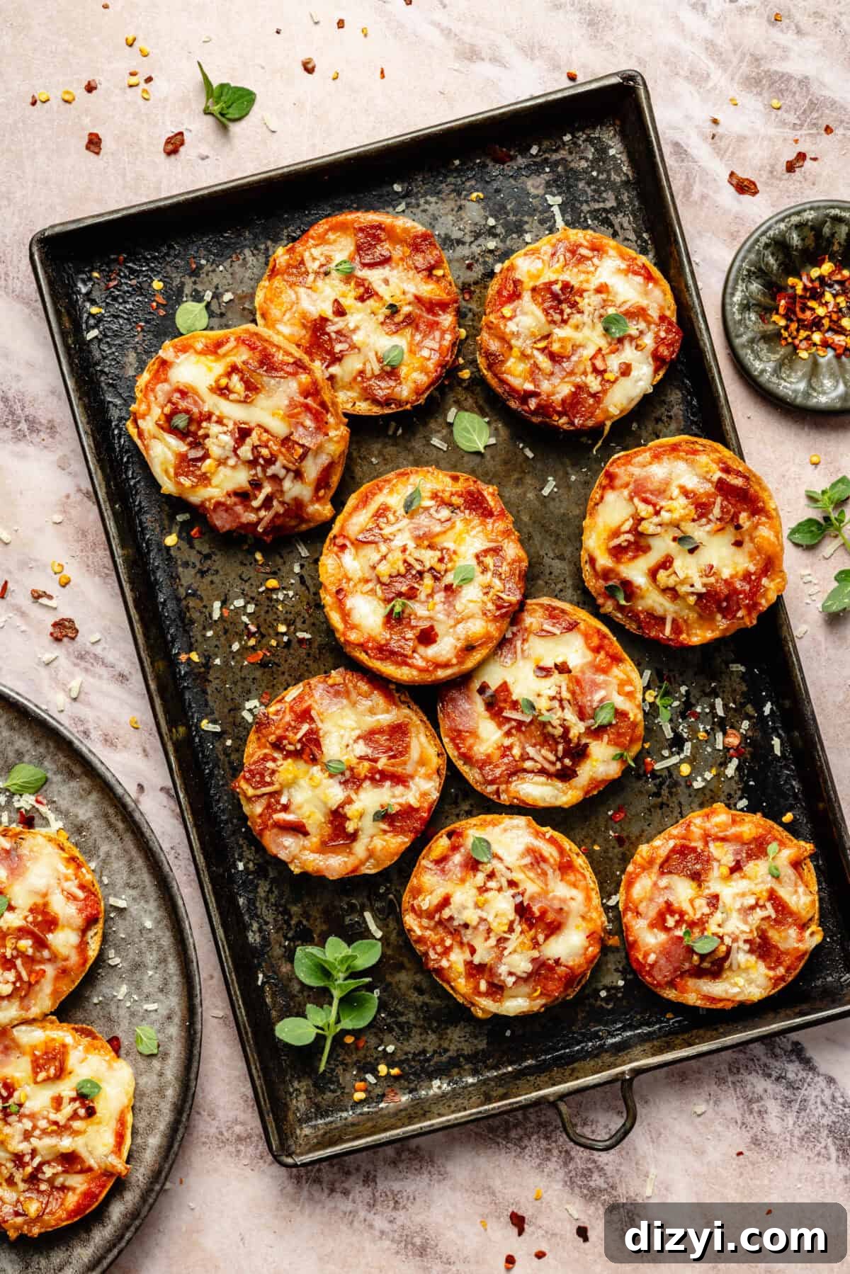 Protein-Packed Gluten-Free Bagel Bites 2 a sheet tray of gluten-free pizza bagels topped with cottage cheese, mozzarella, pepperoni, and salami
