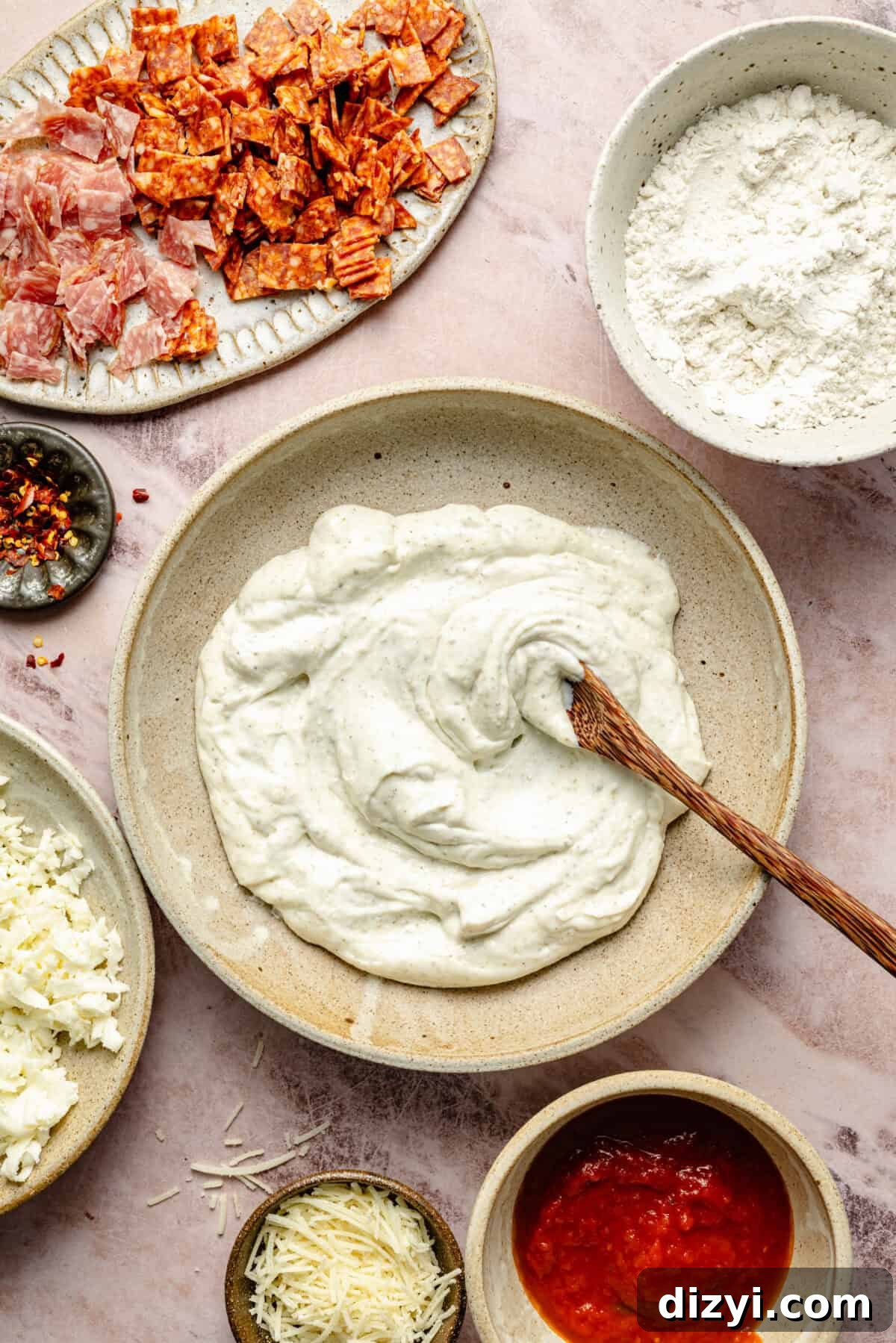 Protein-Packed Gluten-Free Bagel Bites 3 a flat-lay of ingredients for gluten-free protein bagel bites including cottage cheese, mozzarella cheese, pepperoni, and salami