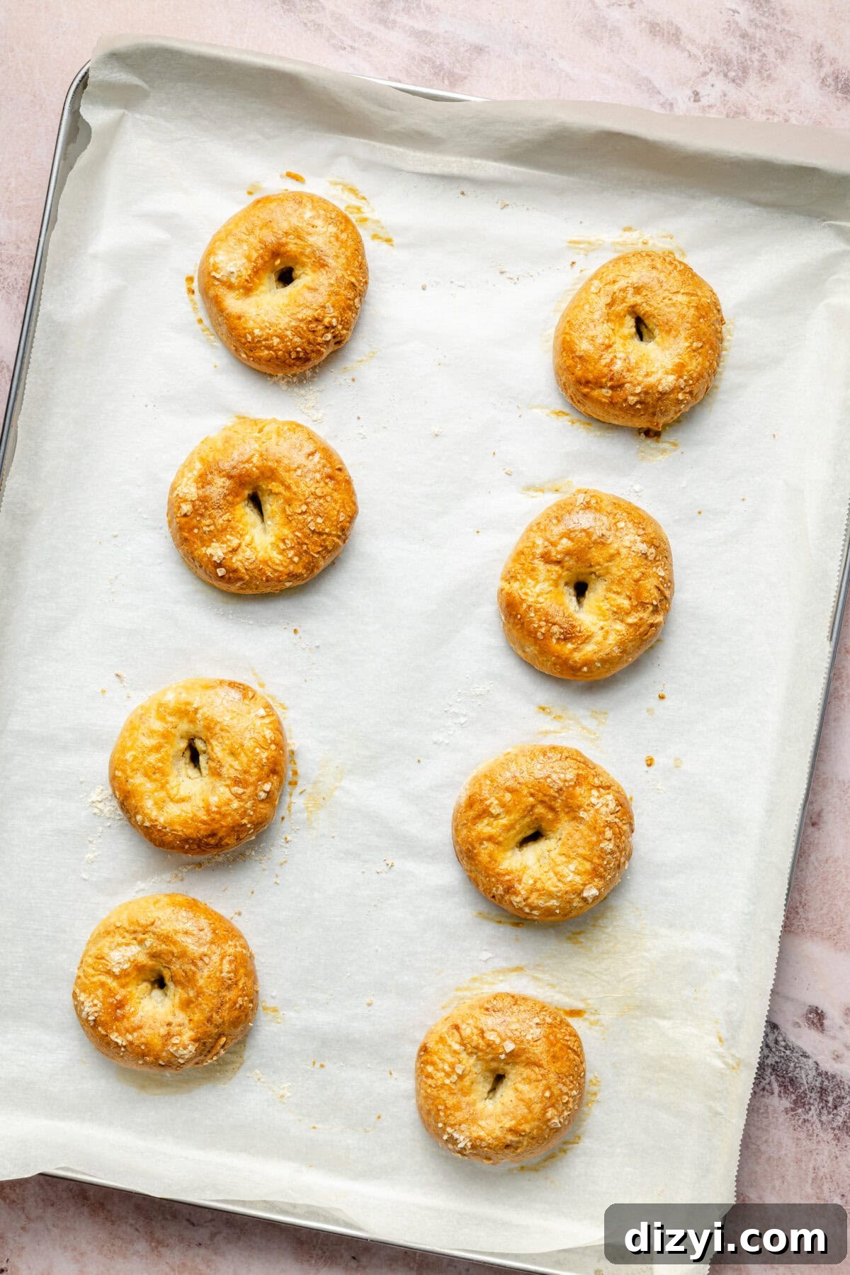 Protein-Packed Gluten-Free Bagel Bites 5 eight baked mini bagels on a parchment paper-lined baking sheet