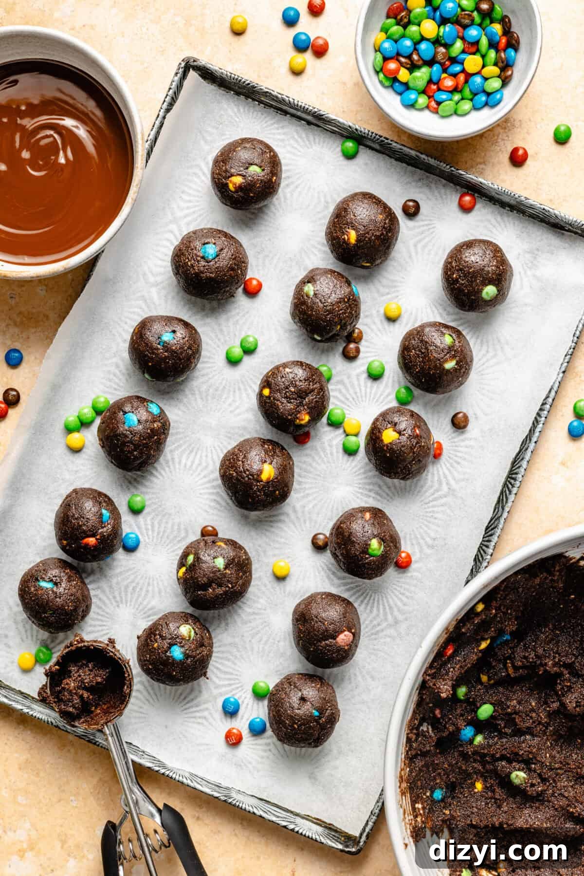 Cosmic Brownie Energy Bites Recipe - No-Bake Chocolate Snack 6 a sheet tray with cosmic brownie-inspired energy bites topped with mini candy pieces