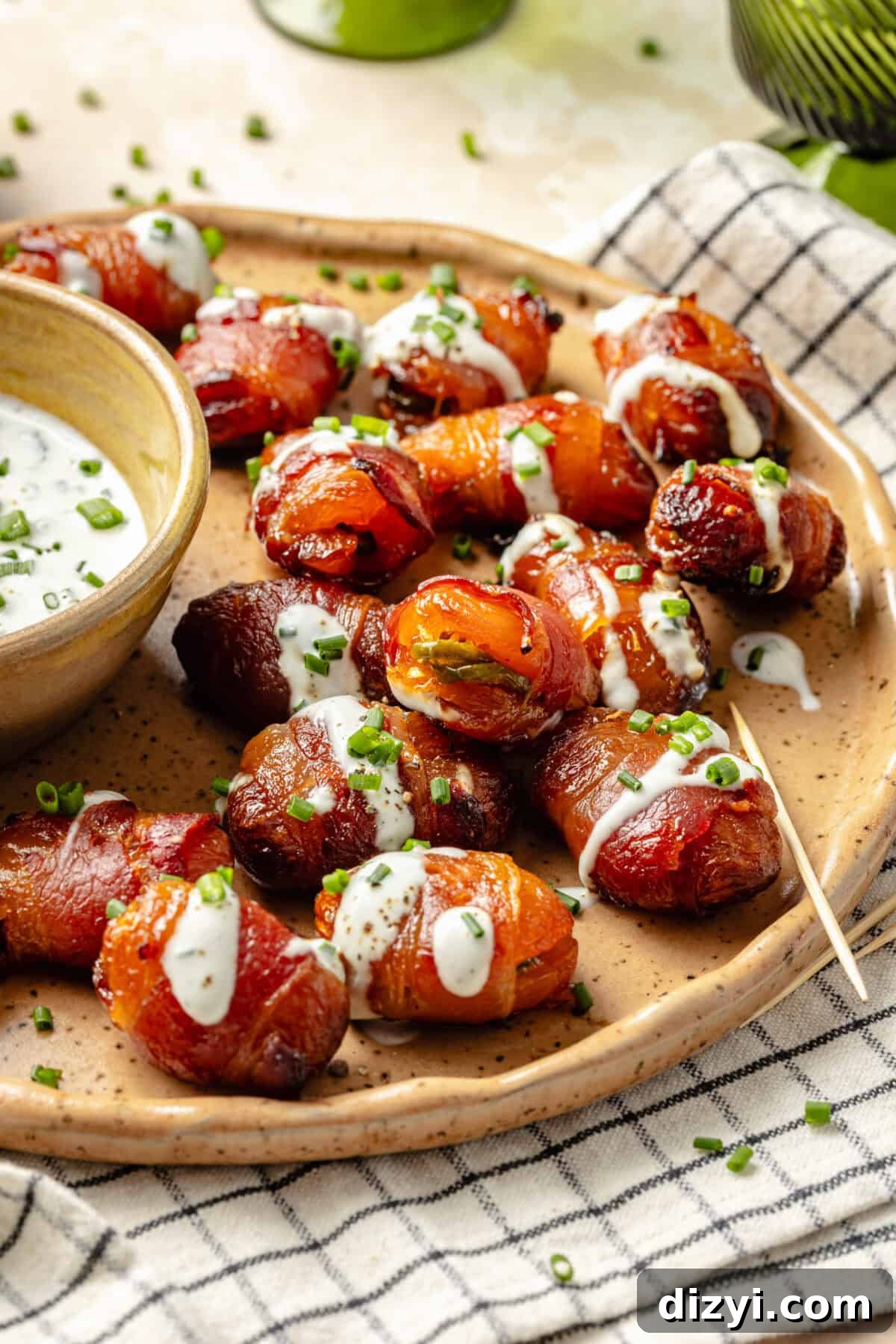 Bacon Wrapped Apricot Bites with Blue Cheese Drizzle 6 crispy and warm bacon-wrapped apricots stuffed with jalapeno peppers and drizzled with a creamy blue cheese sauce