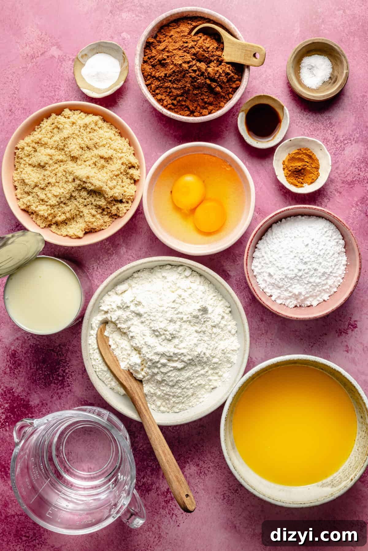 Kiki's Texas Chocolate Sheet Cake Recipe 3 a flat-lay of ingredients to make Texas sheet cake including eggs, flour, cocoa powder, vanilla extract, and more