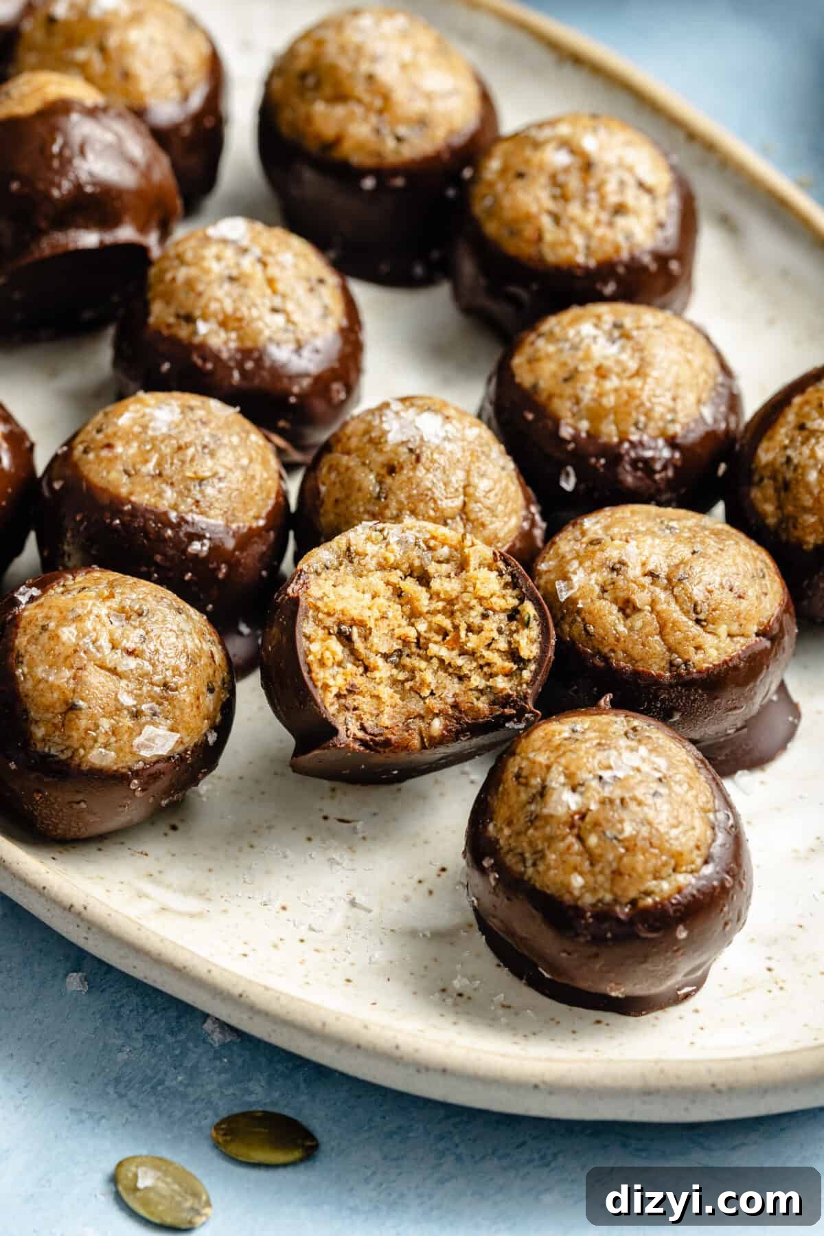 Protein-Packed, Fiber-Rich Buckeye Balls 6 protein balls dipped in melted chocolate and garnished with flaky salt
