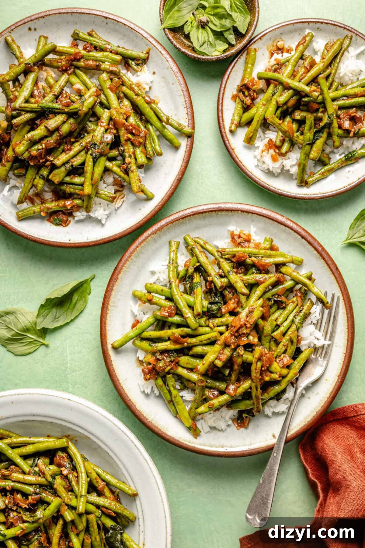 Prik King Stir-Fry: Thai Dry Red Curry 2 four white plates with brown rims featuring green beans and fresh herbs