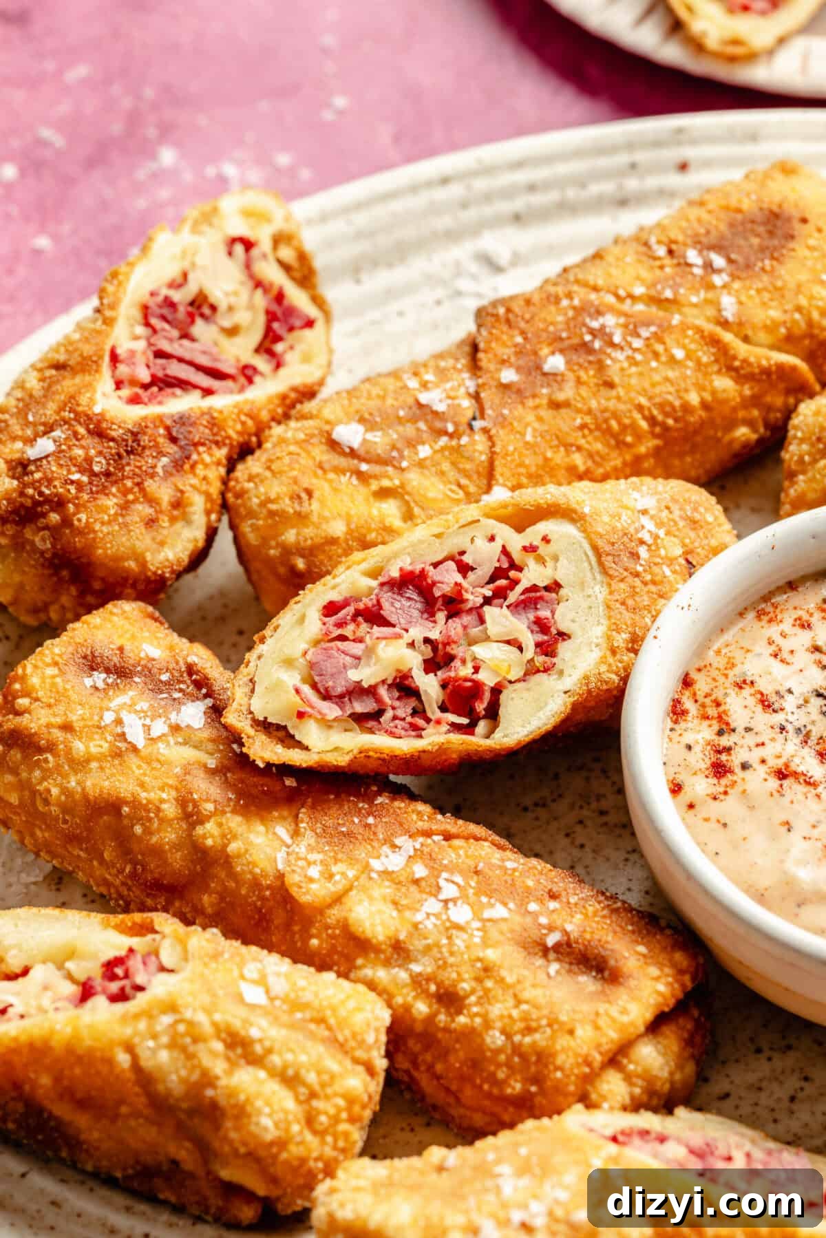 Crispy Reuben Egg Rolls with Thousand Island Dip 7 an up-close shot of sliced reuben egg rolls
