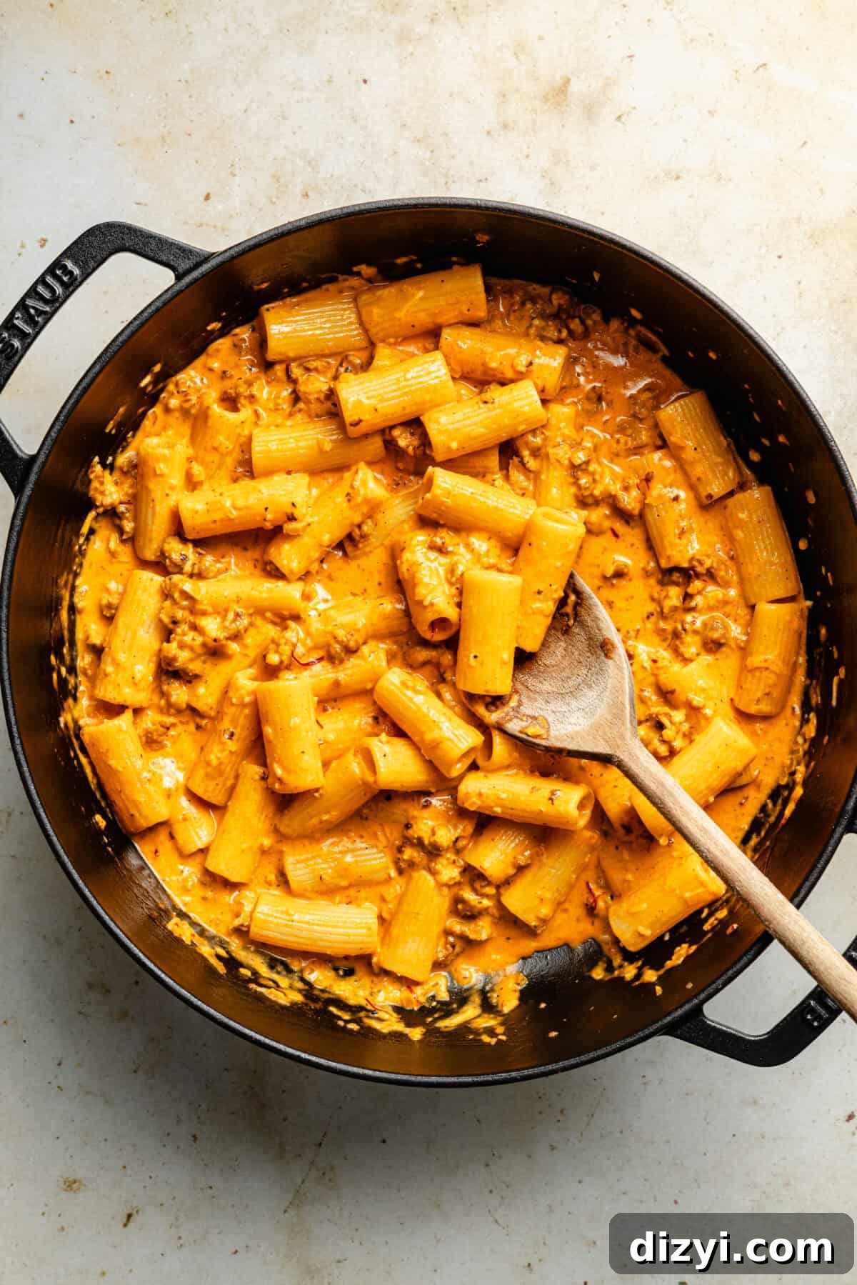 Tossing pasta with sauce