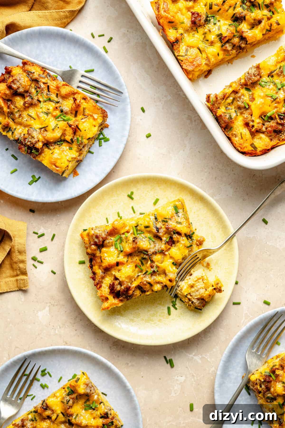 flat-lay of sausage mcmuffin egg bake on individual plates and in a casserole dish